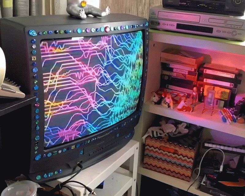 a gorgeous rainbow transmission of the glowing rainbow grid that connects all things. A 3d pan of my "Broadcast Altar TV," displaying an original digital-analog animation. Single Edition Hi-Res GIF token by Sarah Zucker.