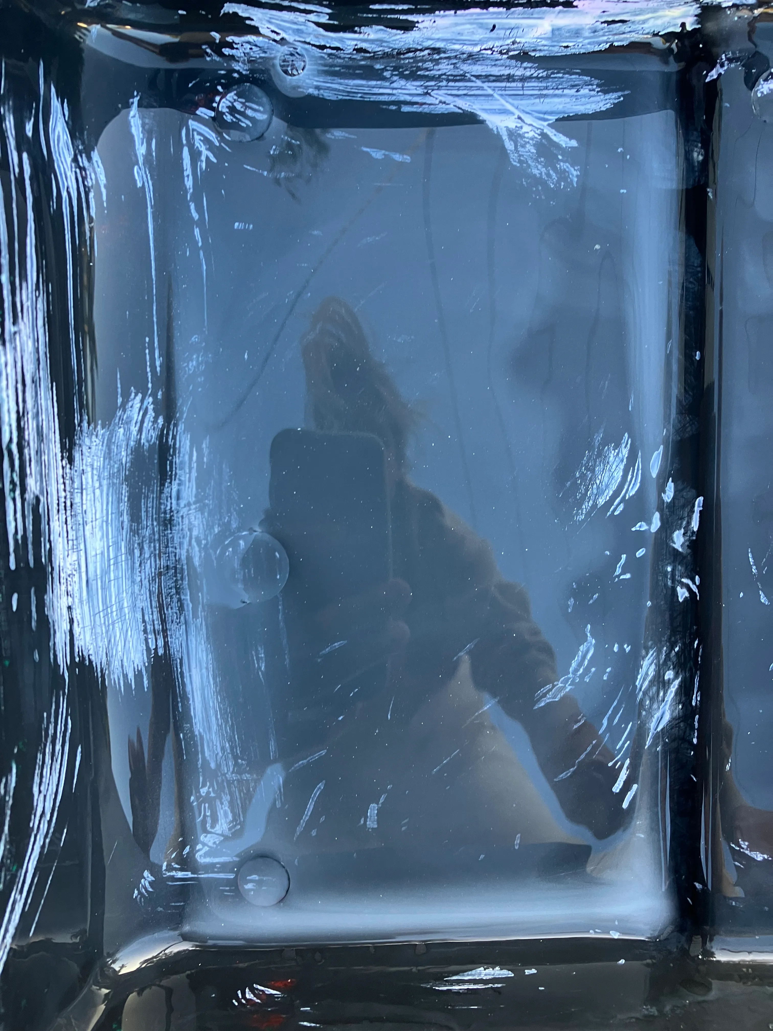 Through the Looking Glass

1/1
jpeg, 3024 x 4032


While washing brushes a wavering self portrait emerges through the cloudy water and residue of paint. A soothing jazz of running water and bird song is a sweet accompaniment.

Some of the most beautiful images I see are in the transient and ephemeral moments of beauty that occur in the process of creating another work. The ‘Aesthetica’ Collection captures, preserves and shares the aesthetic experience of painting that is usually intimately private. Through digital photography, these fleeting images of aesthetic delight become artworks in their own right. No IRL artefact exists outside of these works as they are destroyed as quickly as they are created, painted over in palimpsest, subsumed into another work or washed away. Through this collection, my audience are invited to share in the spontaneous visual pleasure found in the process of painting, which is perhaps for me, the greatest motivating aspect of artistic creation itself.  
