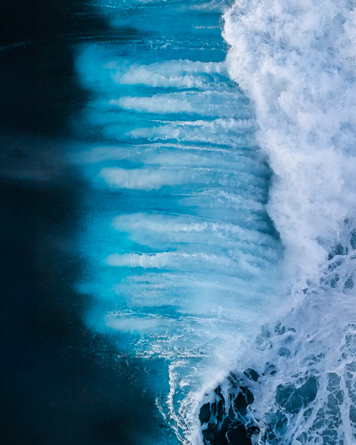 I try to capture beauty and peace in the world where I can. This series brought to life something different in me. Through exploring these heavy swells, often in gale force winds with thunderous clouds and stormy conditions, I realised that sometimes life is unruly and wild. Sometimes experiencing these works and creating them became an outlet for my own rage and fury. A soothing way to release my own frustrations and struggles. Understanding that these moments will return to calm and smoother waters soon enough.

Part of the Ocean Air series. A collection of abstract ocean art captured using aerial photography.