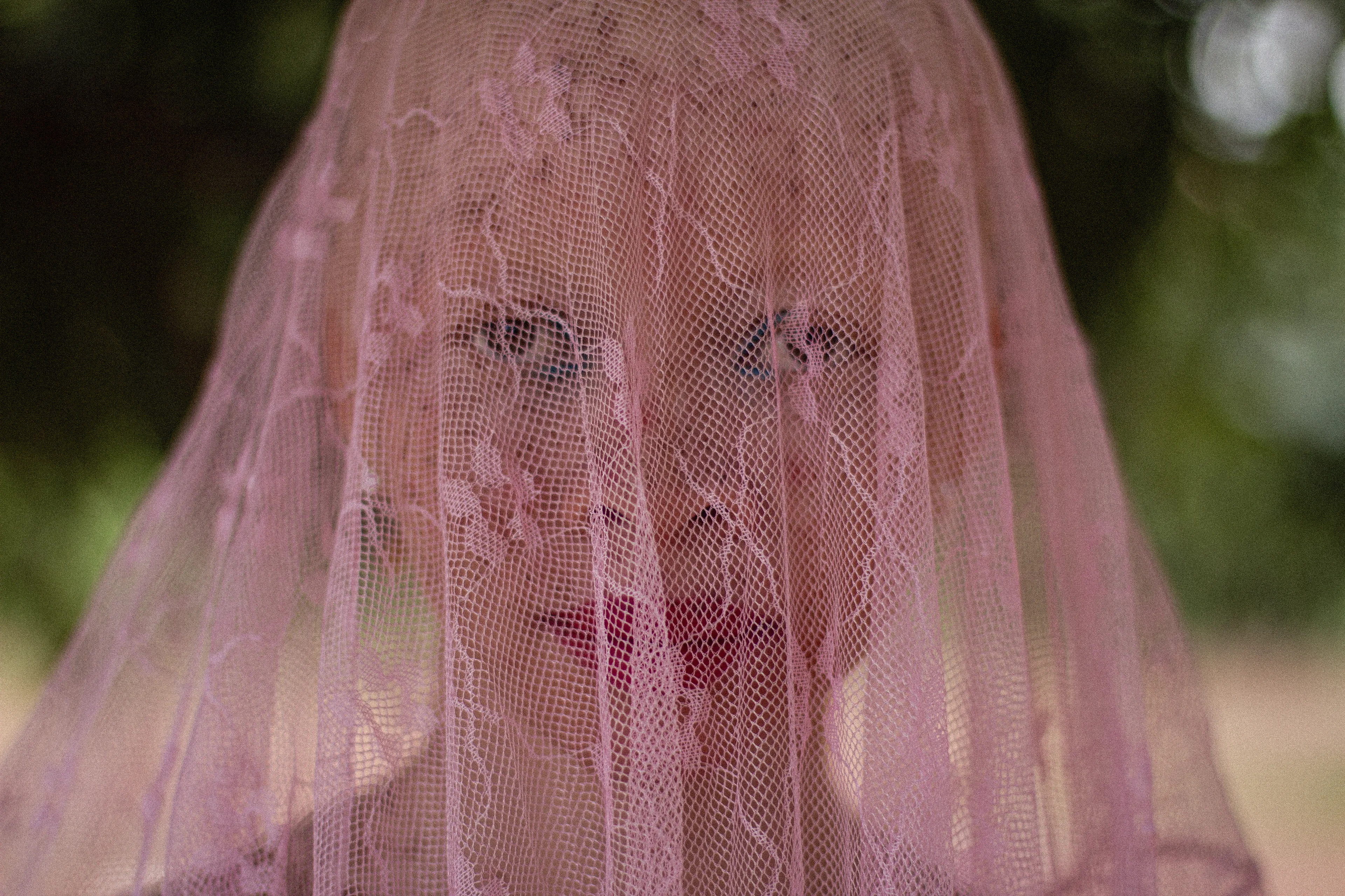 This portrait is a celebration of individuality, capturing the quiet strength and radiance of an extraordinary woman in the first light of an African sunrise.
The balance between anonymity and what we chose to share with the world. Individuality, identity & anonymity all at once.
How even behind a curtain, a veil, a mask – essence can still shine through.