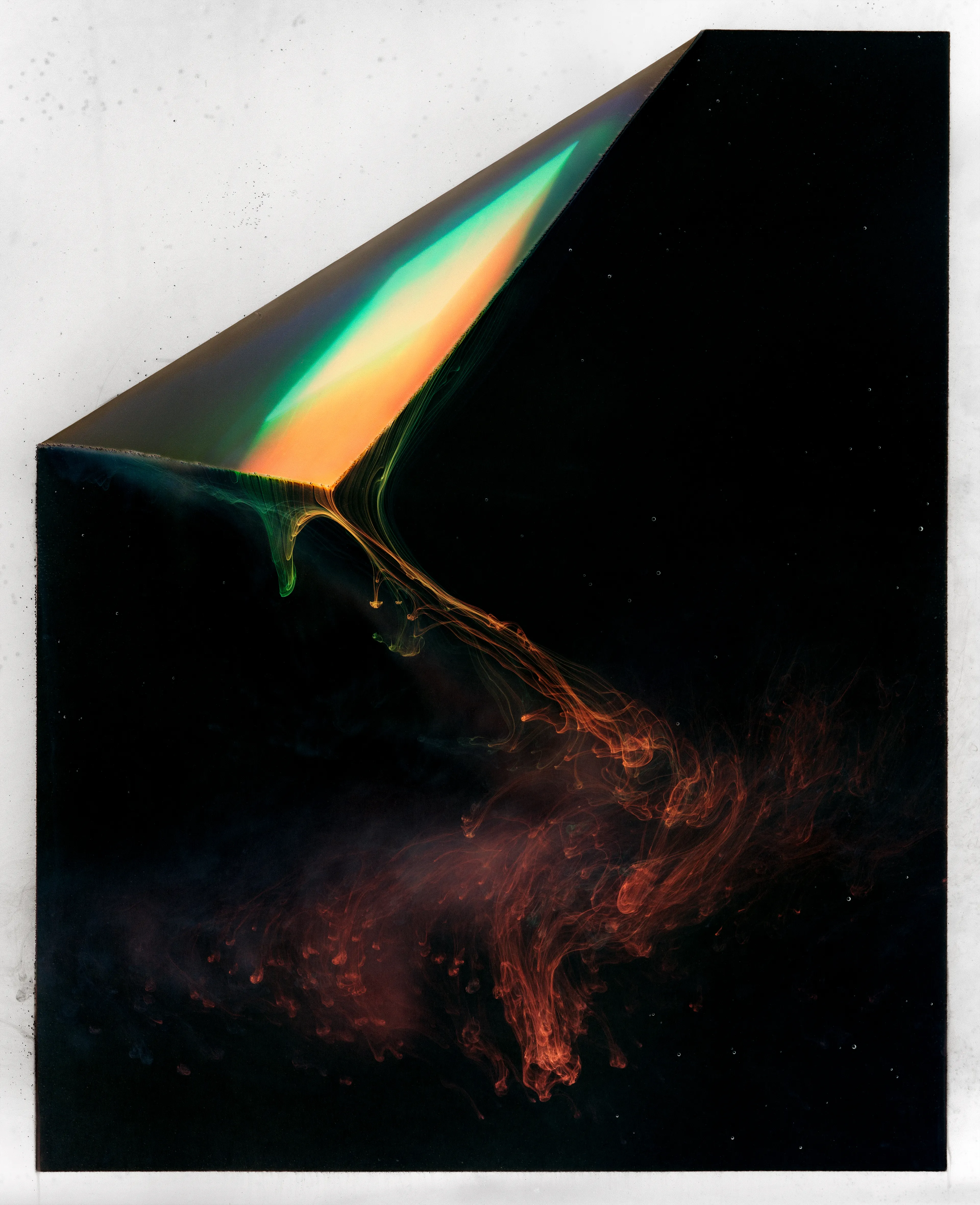 This is a photograph in liquid form -- a record of white light dissolving into the additive colors it is composed of. 

Two exposures are involved. The first was made from the last visible light when I left my home country, New Zealand.  This was captured on film -- light burning salts in an emulsion, rendering a physical record of that moment.

The second exposure was made after I immigrated to the United States and started making work about identity and family history. I developed a chemical process which put that photographic record of light into a liquid state, making it vulnerable and changeable. The second exposure is made during this process which destroys the original photograph, and ultimately becomes non fungible as this 1/1 NFT.

My goal here was to present this past moment as mutable, rearticulated in the process of creating new stories, identity and history.