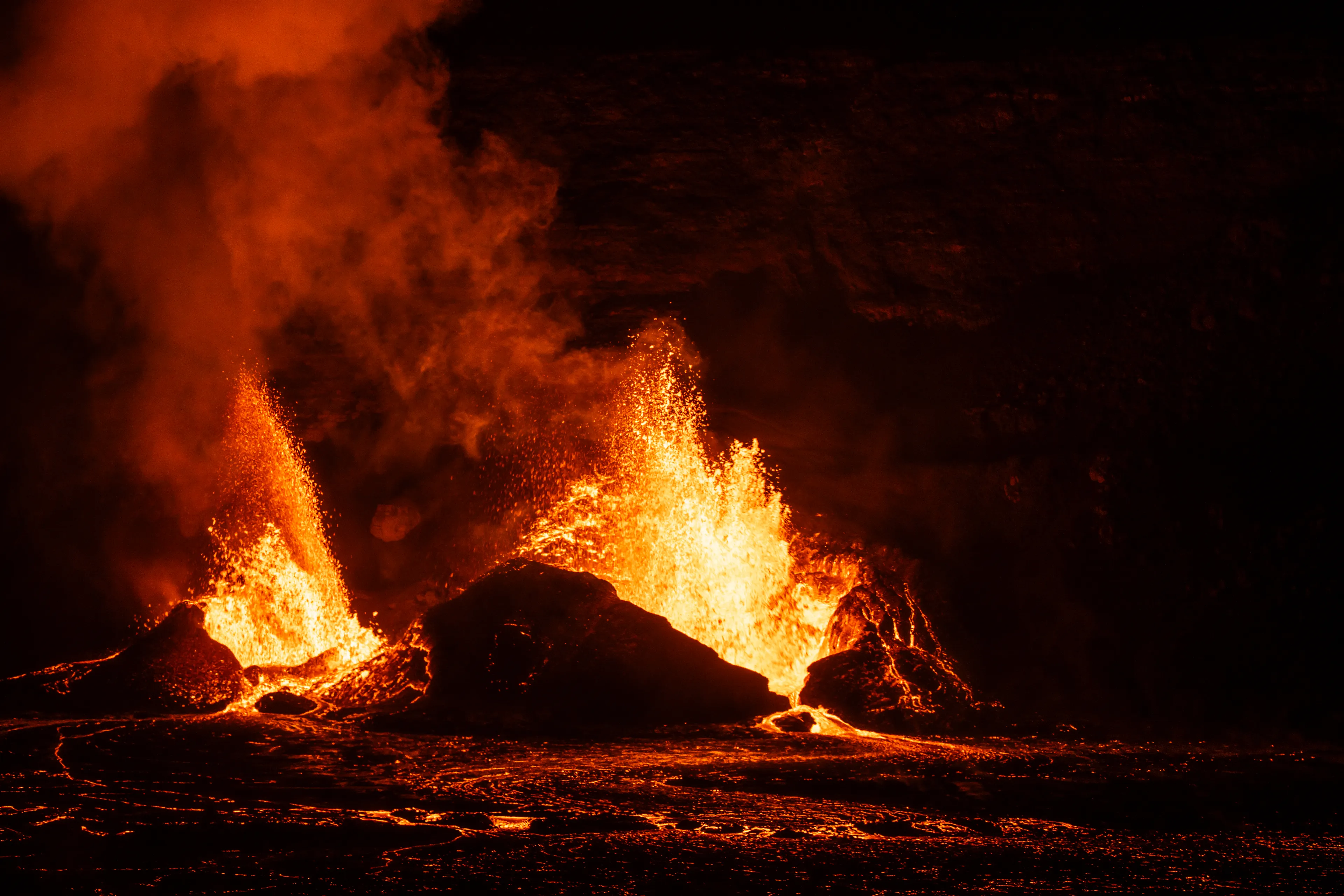 red glow splits the night  
deep booms echo through the dark  
earth spits in fury

photograph by awhurst  
edition 1/1