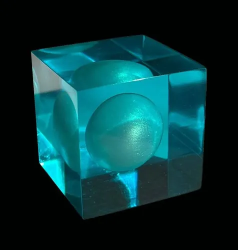 This image represents a node floating in Caribbean-blue resin, referencing the original location of the Mushroom Cloud AR in Miami Beach, FL acknowledging the precarious future of Miami and other coastal cities threatened by rising seas.  At the center of each cube, a single, pearlescent ‘spore’ is suspended, representing the collector’s role in supporting and ‘germinating’ a personal mycelium structure and making a meaningful contribution to the construction of an interactive community.