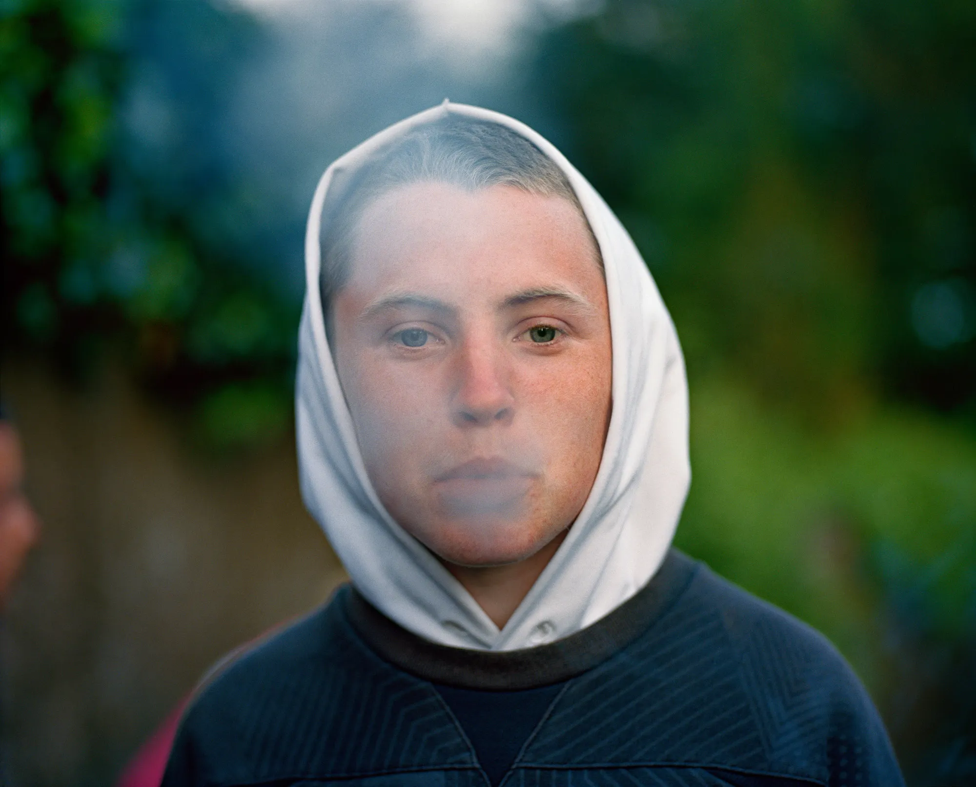 Image caption: Lenny was the only kid who would pose for me my first night photographing in Russell Heights. Everyone was laughing at us—“Aww Lenny, give him a kiss!” But Lenny kept his cool and held his gaze.

Assembly and Sasha Wolf Projects present “My Last Day at Seventeen,” the genesis NFT collection by an American photographer Doug DuBois. Combining portraits, spontaneous encounters and collaborative performances, the images in "My Last Day at Seventeen" hover between documentary and fiction. Doug DuBois was first introduced to a group of teenagers from the Russell Heights housing estate while he was an artist-in-residence in Cobh, on the southwest coast of Ireland. He was fascinated by the insular neighborhood, in which "everyone seems to be someone's cousin, former girlfriend, or spouse." DuBois gained entry when two participants of a workshop he taught took him to a local hangout spot, opening his eyes to a world of not-quite-adults, struggling through the last days of their childhood. Over the course of five years, DuBois returned to Russell Heights examining the uncertainties of growing up in Ireland today while highlighting the unique relationship between artist and subject.

Doug Dubois is a widely-exhibited American photographer well known for capturing intimate familial scenes. His photographs are in the collection of the Museum of Modern Art in NY; SFMOMA in San Francisco; J. Paul Getty Museum and LACMA in Los Angeles; The Museum of Fine Art in Houston; the Library of Congress in Washington DC; and the Victoria and Albert Museum, London.