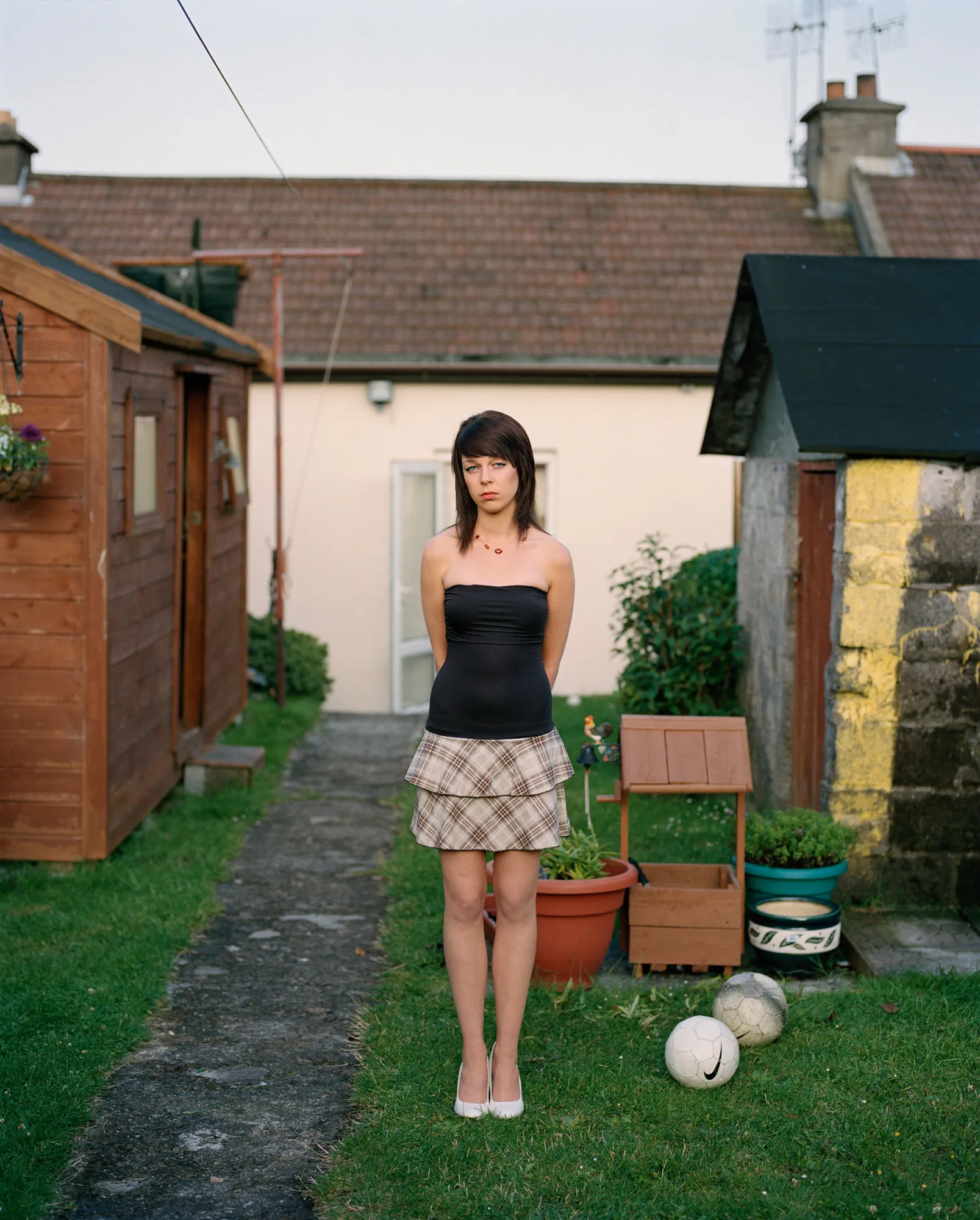 Image caption: The title, “My last day at Seventeen,” was first uttered by Eirn while I was taking her photograph in her parents’ back garden on the eve of her 18th birthday. Although Eirn argues her remark was more properly phrased, “it’s my last day *as* seventeen” the sentiment is the same: there is a time in everyone’s life where the freedom and promise of childhood are lost to the coming of age and experience.

Assembly and Sasha Wolf Projects present “My Last Day at Seventeen,” the genesis NFT collection by an American photographer Doug DuBois. Combining portraits, spontaneous encounters and collaborative performances, the images in "My Last Day at Seventeen" hover between documentary and fiction. Doug DuBois was first introduced to a group of teenagers from the Russell Heights housing estate while he was an artist-in-residence in Cobh, on the southwest coast of Ireland. He was fascinated by the insular neighborhood, in which "everyone seems to be someone's cousin, former girlfriend, or spouse." DuBois gained entry when two participants of a workshop he taught took him to a local hangout spot, opening his eyes to a world of not-quite-adults, struggling through the last days of their childhood. Over the course of five years, DuBois returned to Russell Heights examining the uncertainties of growing up in Ireland today while highlighting the unique relationship between artist and subject.

Doug Dubois is a widely-exhibited American photographer well known for capturing intimate familial scenes. His photographs are in the collection of the Museum of Modern Art in NY; SFMOMA in San Francisco; J. Paul Getty Museum and LACMA in Los Angeles; The Museum of Fine Art in Houston; the Library of Congress in Washington DC; and the Victoria and Albert Museum, London.