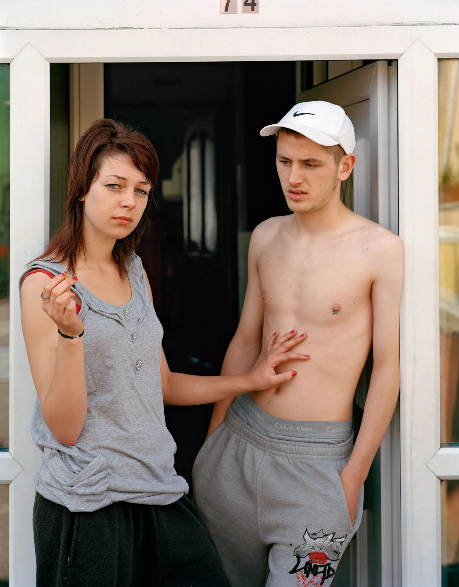Image caption: Eirn and Kevin are now pushing 30. Eirn has her MA in Public Health and Policy from University College Cork, Kevin dabbles in Cryptocurrency.

Assembly and Sasha Wolf Projects present “My Last Day at Seventeen,” the genesis NFT collection by an American photographer Doug DuBois. Combining portraits, spontaneous encounters and collaborative performances, the images in "My Last Day at Seventeen" hover between documentary and fiction. Doug DuBois was first introduced to a group of teenagers from the Russell Heights housing estate while he was an artist-in-residence in Cobh, on the southwest coast of Ireland. He was fascinated by the insular neighborhood, in which "everyone seems to be someone's cousin, former girlfriend, or spouse." DuBois gained entry when two participants of a workshop he taught took him to a local hangout spot, opening his eyes to a world of not-quite-adults, struggling through the last days of their childhood. Over the course of five years, DuBois returned to Russell Heights examining the uncertainties of growing up in Ireland today while highlighting the unique relationship between artist and subject.

Doug Dubois is a widely-exhibited American photographer well known for capturing intimate familial scenes. His photographs are in the collection of the Museum of Modern Art in NY; SFMOMA in San Francisco; J. Paul Getty Museum and LACMA in Los Angeles; The Museum of Fine Art in Houston; the Library of Congress in Washington DC; and the Victoria and Albert Museum, London.