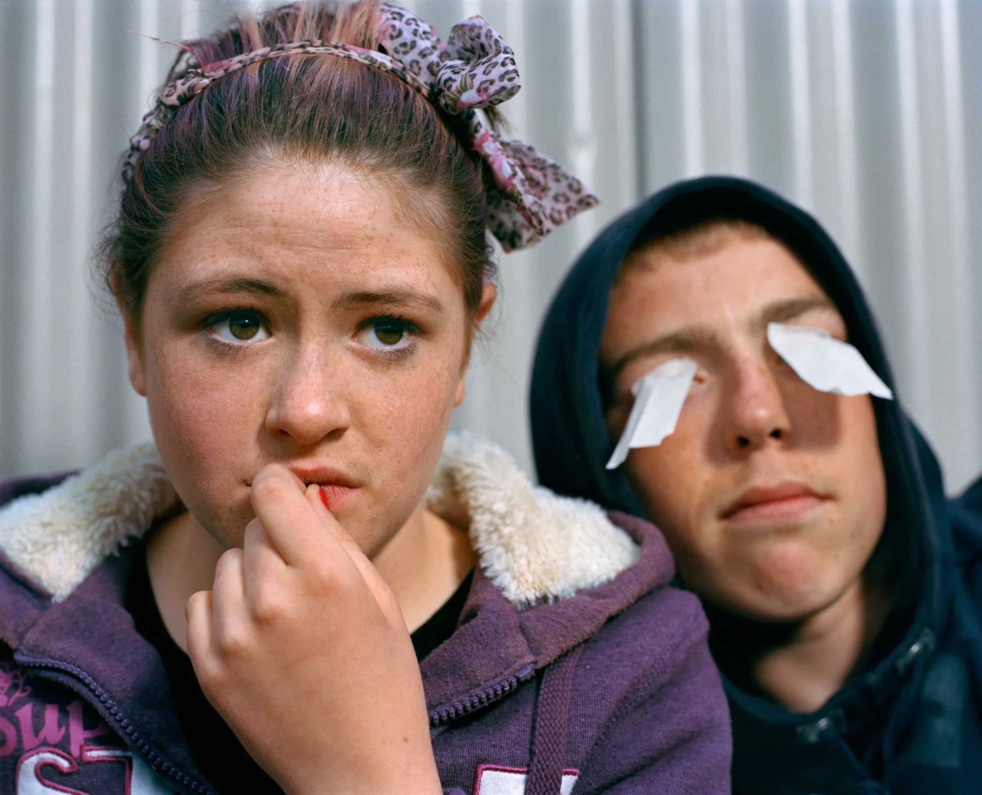 Image caption: Roisin and Jordan hanging out somewhere among the brambles that grow out of a half-finished housing site.

Assembly and Sasha Wolf Projects present “My Last Day at Seventeen,” the genesis NFT collection by an American photographer Doug DuBois. Combining portraits, spontaneous encounters and collaborative performances, the images in "My Last Day at Seventeen" hover between documentary and fiction. Doug DuBois was first introduced to a group of teenagers from the Russell Heights housing estate while he was an artist-in-residence in Cobh, on the southwest coast of Ireland. He was fascinated by the insular neighborhood, in which "everyone seems to be someone's cousin, former girlfriend, or spouse." DuBois gained entry when two participants of a workshop he taught took him to a local hangout spot, opening his eyes to a world of not-quite-adults, struggling through the last days of their childhood. Over the course of five years, DuBois returned to Russell Heights examining the uncertainties of growing up in Ireland today while highlighting the unique relationship between artist and subject.

Doug Dubois is a widely-exhibited American photographer well known for capturing intimate familial scenes. His photographs are in the collection of the Museum of Modern Art in NY; SFMOMA in San Francisco; J. Paul Getty Museum and LACMA in Los Angeles; The Museum of Fine Art in Houston; the Library of Congress in Washington DC; and the Victoria and Albert Museum, London.