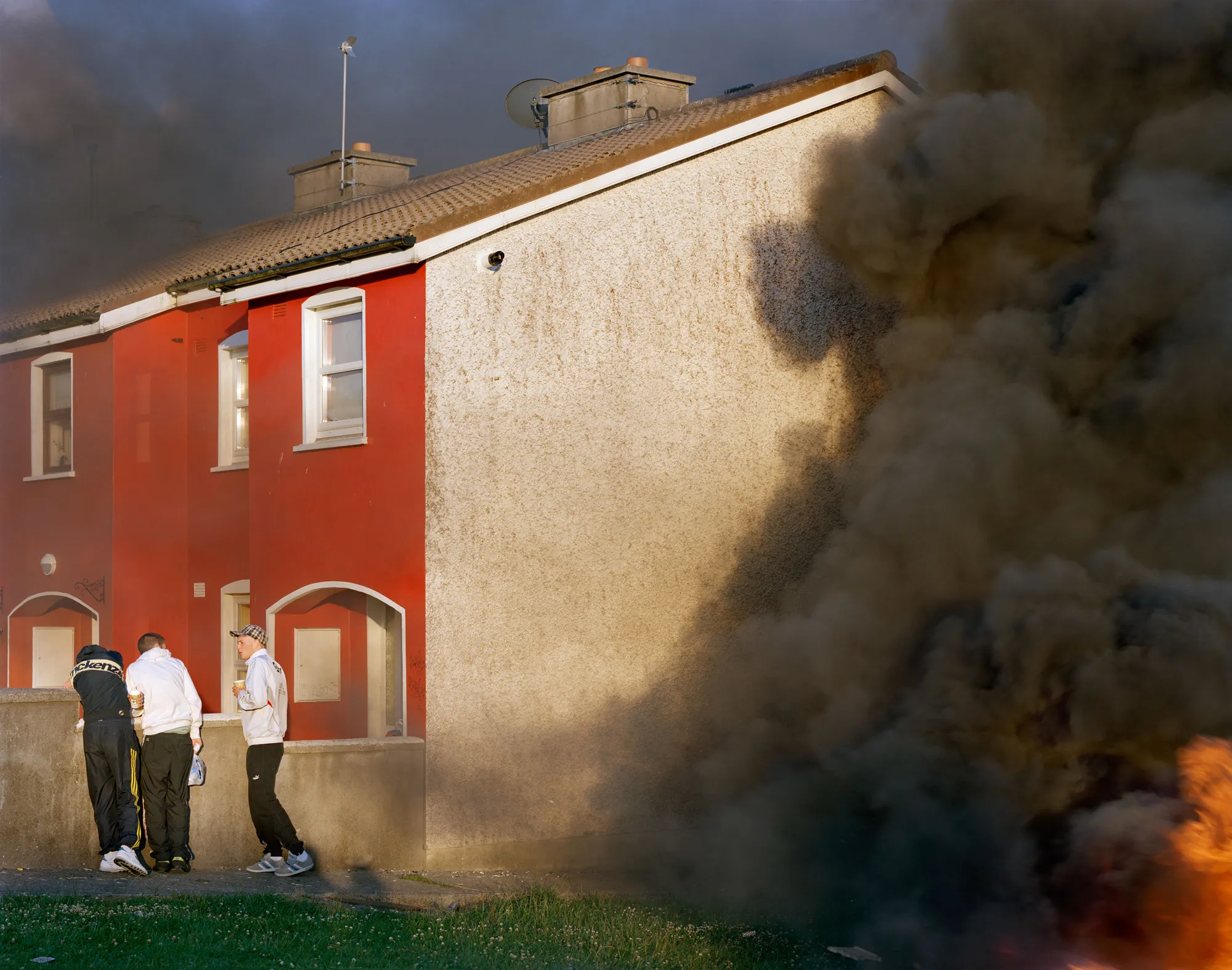 Image caption: Midsummer bonfires go back at least 5000 years in Ireland. In Russell Heights, the neighborhood kids knock on doors looking for scraps of wood, old furniture and the occasional mattress to burn. It’s a big party.

Assembly and Sasha Wolf Projects present “My Last Day at Seventeen,” the genesis NFT collection by an American photographer Doug DuBois. Combining portraits, spontaneous encounters and collaborative performances, the images in "My Last Day at Seventeen" hover between documentary and fiction. Doug DuBois was first introduced to a group of teenagers from the Russell Heights housing estate while he was an artist-in-residence in Cobh, on the southwest coast of Ireland. He was fascinated by the insular neighborhood, in which "everyone seems to be someone's cousin, former girlfriend, or spouse." DuBois gained entry when two participants of a workshop he taught took him to a local hangout spot, opening his eyes to a world of not-quite-adults, struggling through the last days of their childhood. Over the course of five years, DuBois returned to Russell Heights examining the uncertainties of growing up in Ireland today while highlighting the unique relationship between artist and subject.

Doug Dubois is a widely-exhibited American photographer well known for capturing intimate familial scenes. His photographs are in the collection of the Museum of Modern Art in NY; SFMOMA in San Francisco; J. Paul Getty Museum and LACMA in Los Angeles; The Museum of Fine Art in Houston; the Library of Congress in Washington DC; and the Victoria and Albert Museum, London.