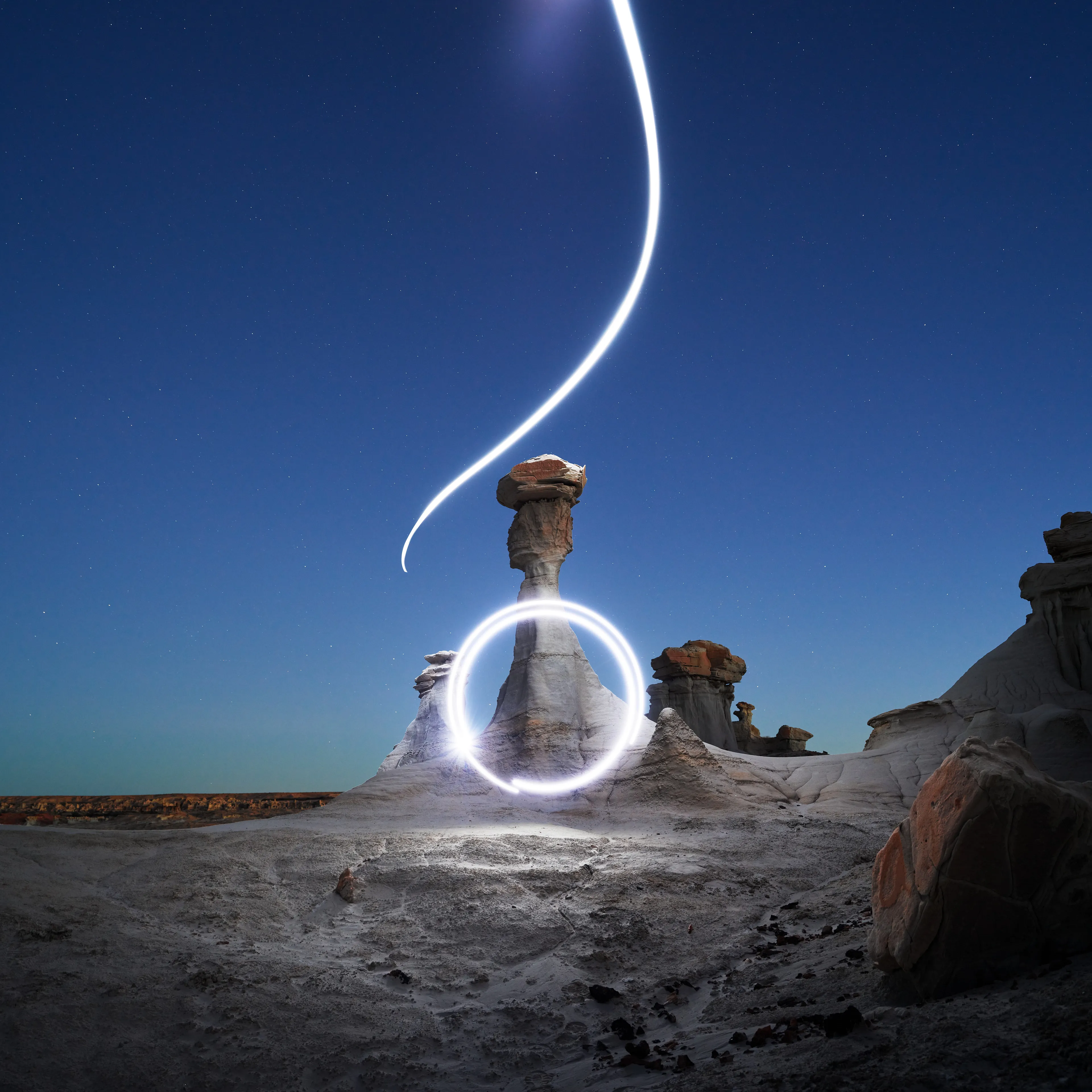 Aeroglyph Variations #9 by Reuben Wu

Aeroglyph Variations is a collection evolved from my Aeroglyphs body of work, created exclusively for Obscura Curated. 

Aeroglyphs explores my method of intervention in landscape photography. By using light carrying drones and long exposure, I’m able to play a larger role in artistic expression all without leaving a trace on the scene.

This series was captured over the course of 20 hours in New Mexico, USA on Dec 12-13 2021. It shows the iterative processes and decisions I typically encounter during the creation of a final image, presented as a collection of 55 images. Compositionally, every image is the same, yet in attributes, every image is different. Time of day, light formations (glyphs) and other traits vary within the series to result in a spectrum of unique possibilities.

Taking inspiration from generative art and groundbreaking photo projects such as Carpoolers (Alejandro Cartagena), this project examines the notion of the photographer as algorithm; the code that creates and which ultimately derives from our unique programming of life experiences.
Reuben Wu's OpenSea: https://opensea.io/itsreuben?tab=created

Edition: 1 of 1

Commissioned by Obscura