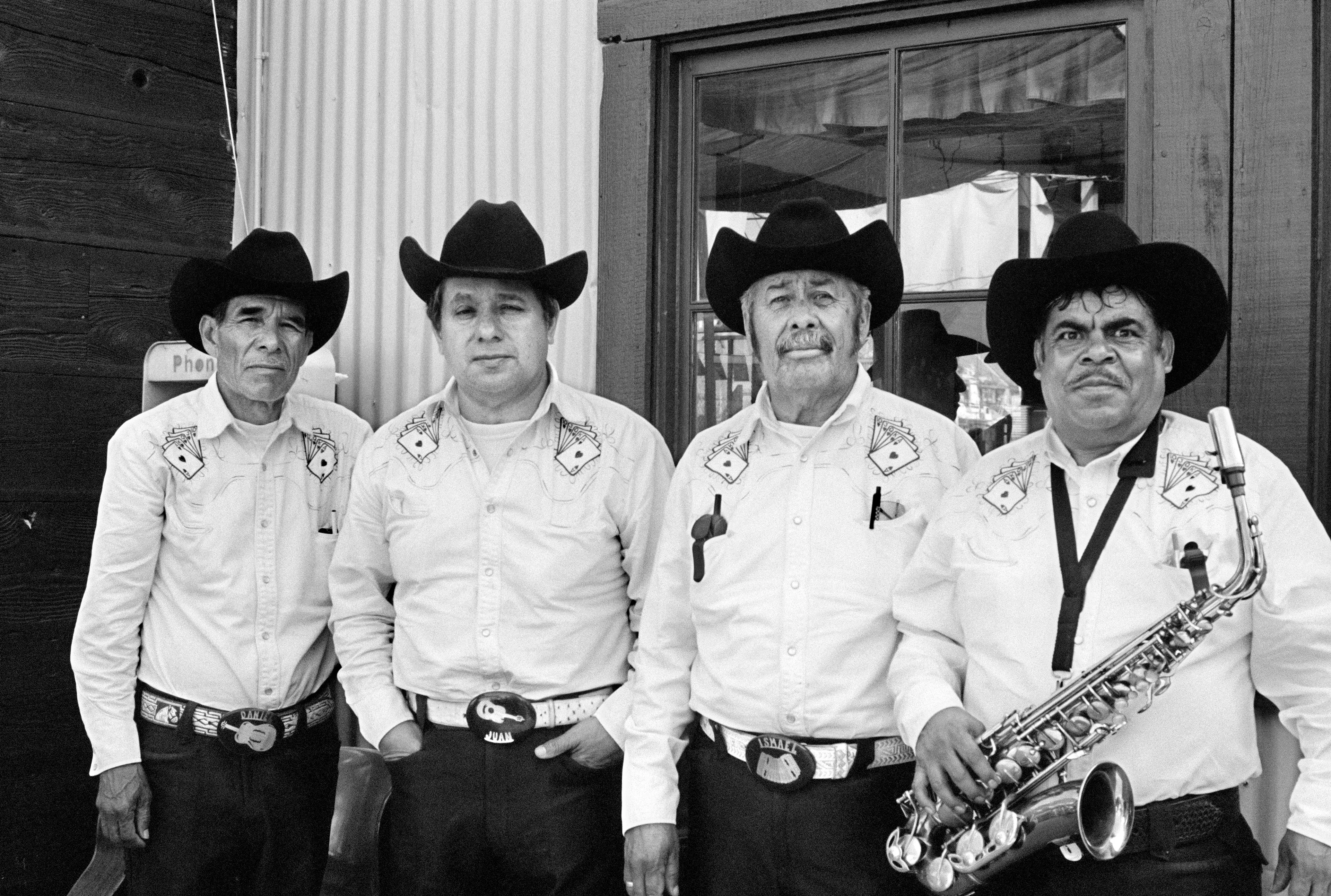THE VILLAGE #16 PORTRAIT OF FOUR MARIACHI'S by Deanna Templeton

This project started in 2002. A year after my mother passed away, a few years after my father passed. What I remember was one day I was thinking about my parents and feeling a little bit lonely, a little empty and decided to go for a drive. So I decided to drive out to my grandmother's house in San Pedro, which is about a 45 minute drive from where I live. I just wanted to reminisce, to re-explore the surroundings where I would go when I was a child. The liquor store I would walk to to get a Lipton Ice Tea and a bag of Frito’s, to the bakery where I swore all the cookies didn’t have sugar in them and then I drove over to Ports O’Call Village. As soon as I started to walk around I came across a stage with some Mariachis playing and it just hit me, I felt like I was home, I was with family. Over the next 5 years, whenever I could, I started going out there on the weekends. Getting reacquainted with the village and the locals. To shoot everything I wanted to remember.

Edition: 1 of 1

Commissioned by Obscura