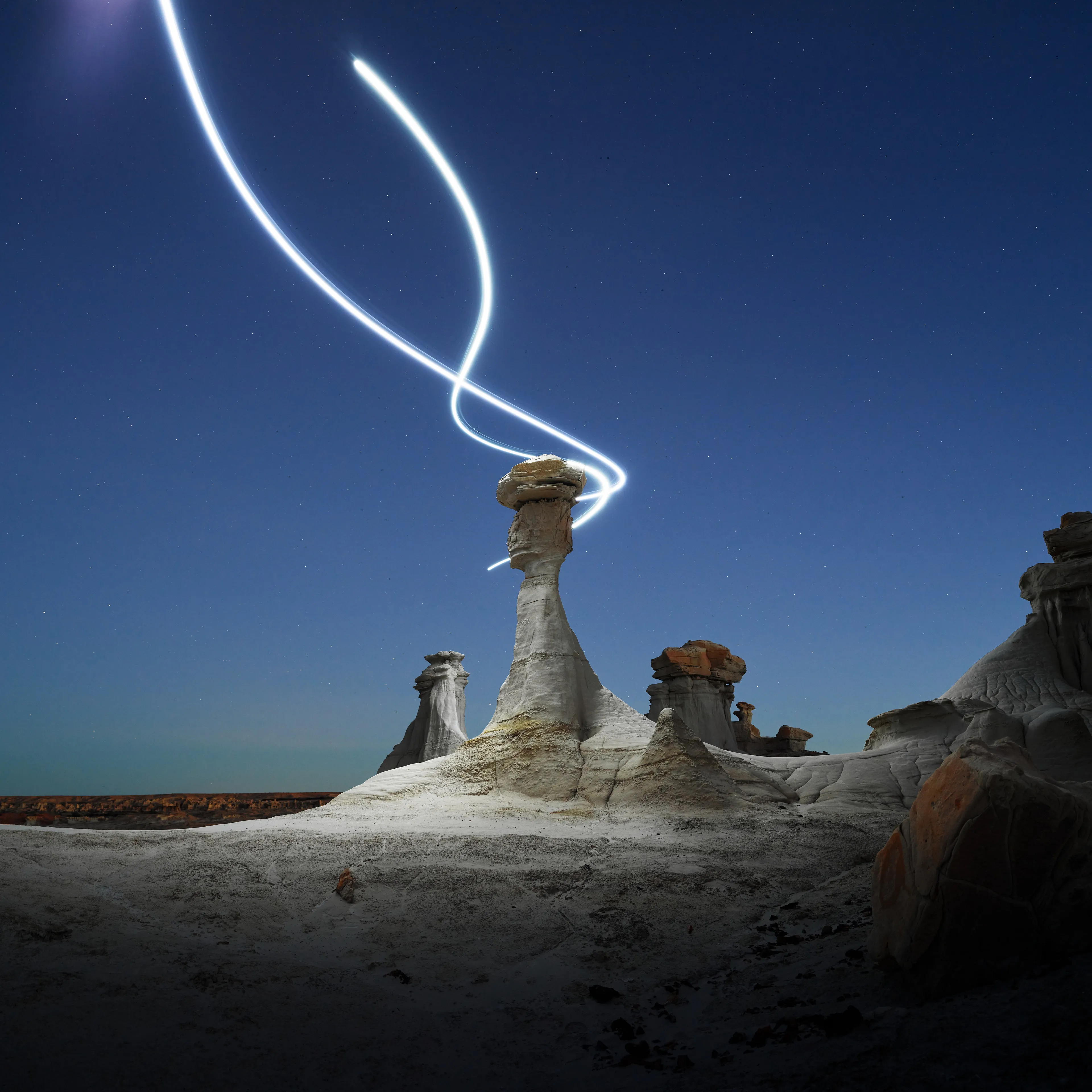 Aeroglyph Variations #7 by Reuben Wu

Aeroglyph Variations is a collection evolved from my Aeroglyphs body of work, created exclusively for Obscura Curated. 

Aeroglyphs explores my method of intervention in landscape photography. By using light carrying drones and long exposure, I’m able to play a larger role in artistic expression all without leaving a trace on the scene.

This series was captured over the course of 20 hours in New Mexico, USA on Dec 12-13 2021. It shows the iterative processes and decisions I typically encounter during the creation of a final image, presented as a collection of 55 images. Compositionally, every image is the same, yet in attributes, every image is different. Time of day, light formations (glyphs) and other traits vary within the series to result in a spectrum of unique possibilities.

Taking inspiration from generative art and groundbreaking photo projects such as Carpoolers (Alejandro Cartagena), this project examines the notion of the photographer as algorithm; the code that creates and which ultimately derives from our unique programming of life experiences.
Reuben Wu's OpenSea: https://opensea.io/itsreuben?tab=created

Edition: 1 of 1

Commissioned by Obscura