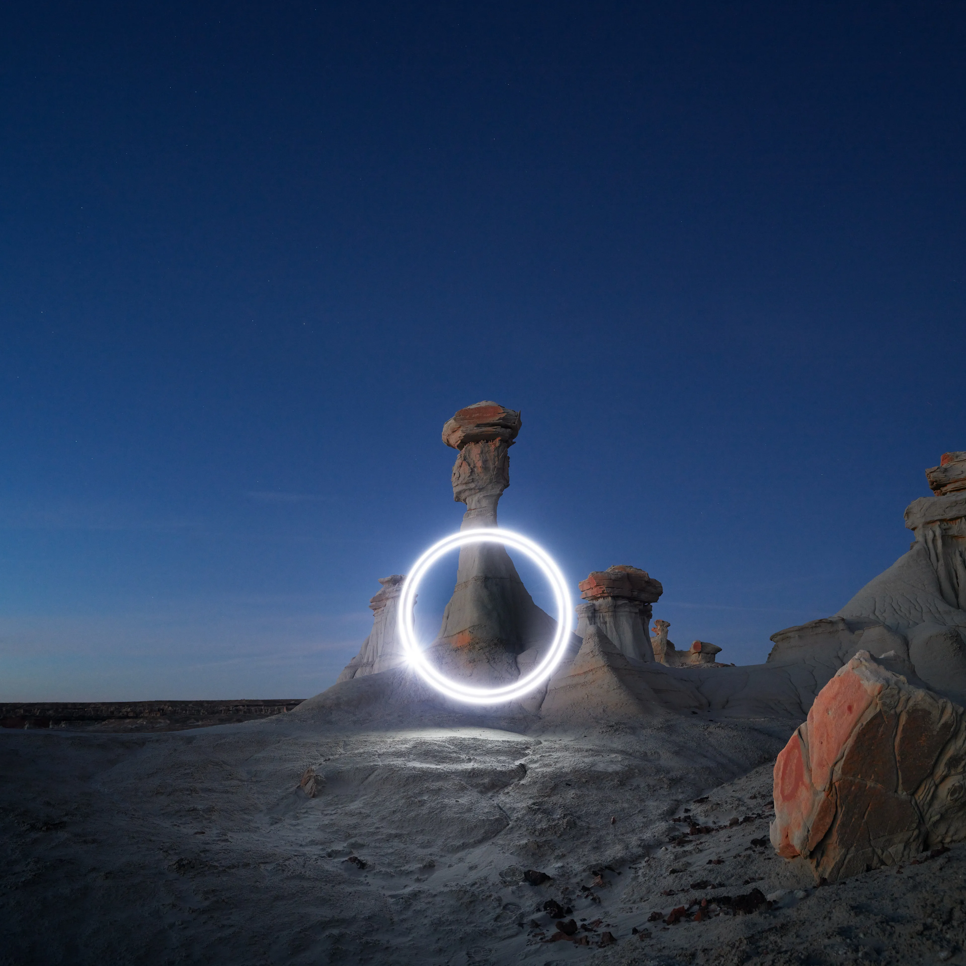 Aeroglyph Variations #5 by Reuben Wu

Aeroglyph Variations is a collection evolved from my Aeroglyphs body of work, created exclusively for Obscura Curated. 

Aeroglyphs explores my method of intervention in landscape photography. By using light carrying drones and long exposure, I’m able to play a larger role in artistic expression all without leaving a trace on the scene.

This series was captured over the course of 20 hours in New Mexico, USA on Dec 12-13 2021. It shows the iterative processes and decisions I typically encounter during the creation of a final image, presented as a collection of 55 images. Compositionally, every image is the same, yet in attributes, every image is different. Time of day, light formations (glyphs) and other traits vary within the series to result in a spectrum of unique possibilities.

Taking inspiration from generative art and groundbreaking photo projects such as Carpoolers (Alejandro Cartagena), this project examines the notion of the photographer as algorithm; the code that creates and which ultimately derives from our unique programming of life experiences.
Reuben Wu's OpenSea: https://opensea.io/itsreuben?tab=created

Edition: 1 of 1

Commissioned by Obscura