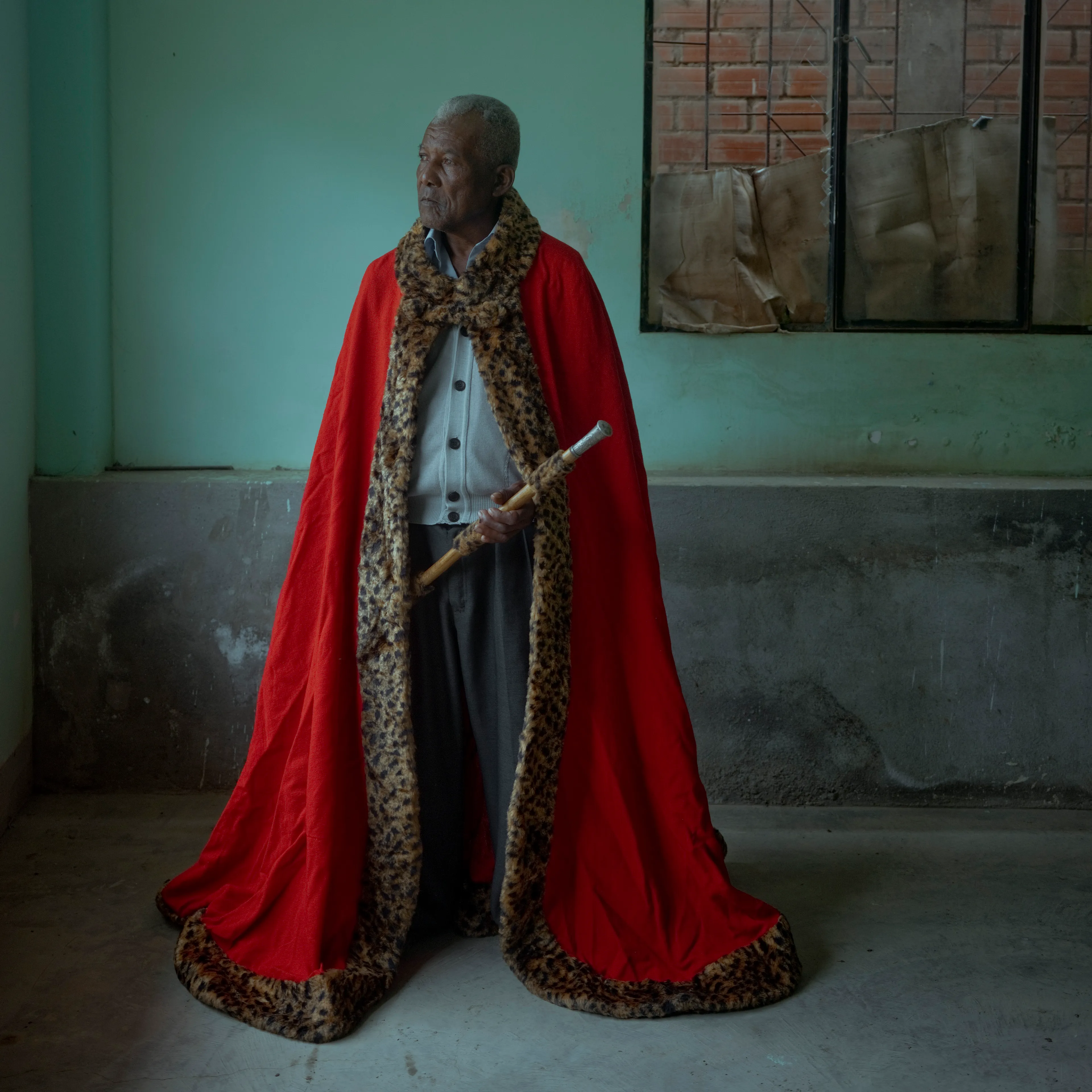 The Royal Pinedo #4 by Cristina de Middel

In the tropical region of Los Yungas in Bolivia, surrounded by coca plantations, Cristina De Middel has encountered the story of a King. His name is Julio Pinedo. Julio is a descendant of prince Uchicho, the King of the Kikongo tribe that arrived from the Congo in 1820. This collection will document the daily life of a quite unusual king, recognizing his legacy and the oral tradition that remains after 3 generations. The story will show how this legacy plays out within the the current problematic coca industry in the country, which is still one of Bolivia's biggest agricultural productions.

Edition: 1 of 1

Commissioned by Obscura
