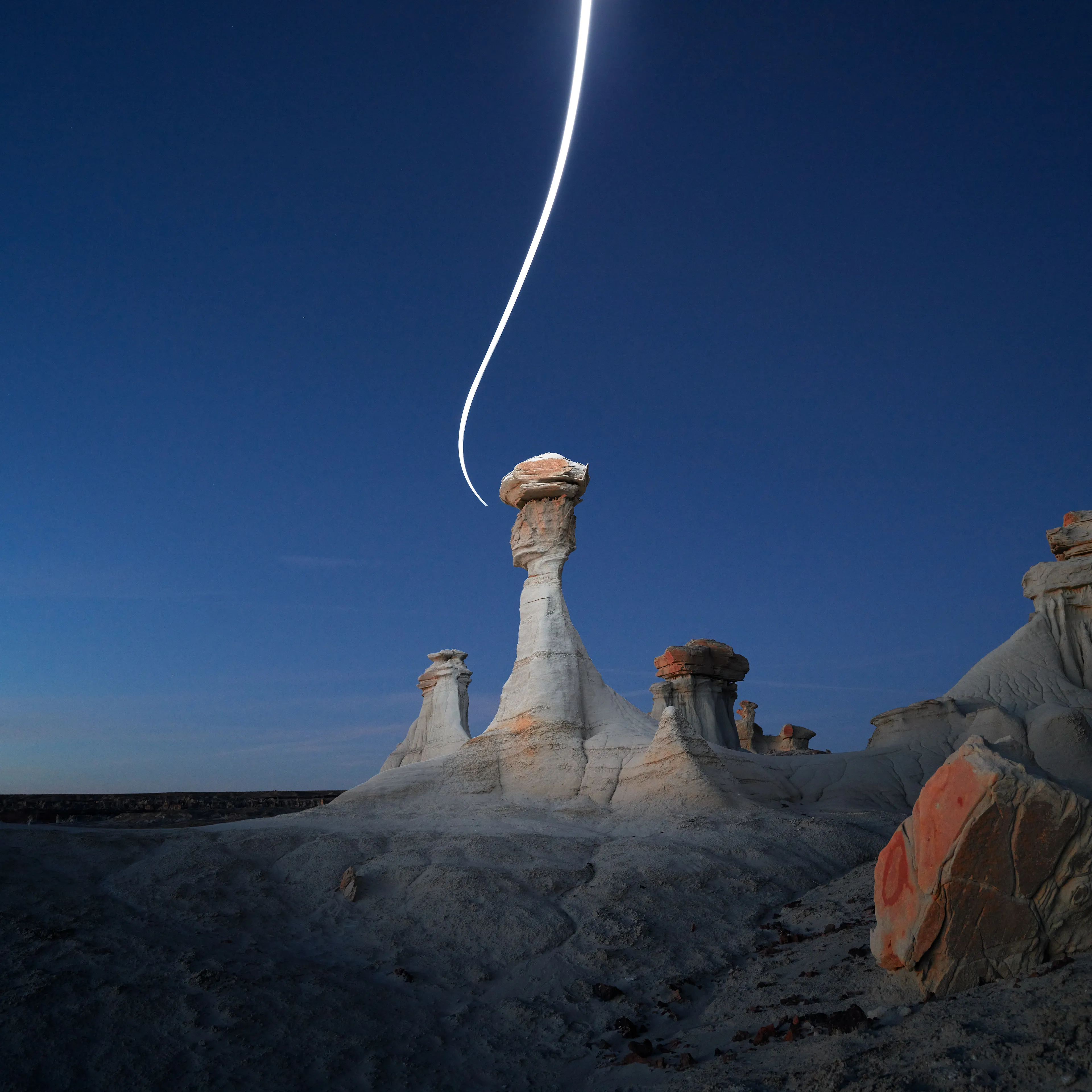 Aeroglyph Variations #1 by Reuben Wu

Aeroglyph Variations is a collection evolved from my Aeroglyphs body of work, created exclusively for Obscura Curated. 

Aeroglyphs explores my method of intervention in landscape photography. By using light carrying drones and long exposure, I’m able to play a larger role in artistic expression all without leaving a trace on the scene.

This series was captured over the course of 20 hours in New Mexico, USA on Dec 12-13 2021. It shows the iterative processes and decisions I typically encounter during the creation of a final image, presented as a collection of 55 images. Compositionally, every image is the same, yet in attributes, every image is different. Time of day, light formations (glyphs) and other traits vary within the series to result in a spectrum of unique possibilities.

Taking inspiration from generative art and groundbreaking photo projects such as Carpoolers (Alejandro Cartagena), this project examines the notion of the photographer as algorithm; the code that creates and which ultimately derives from our unique programming of life experiences.
Reuben Wu's OpenSea: https://opensea.io/itsreuben?tab=created

Edition: 1 of 1

Commissioned by Obscura