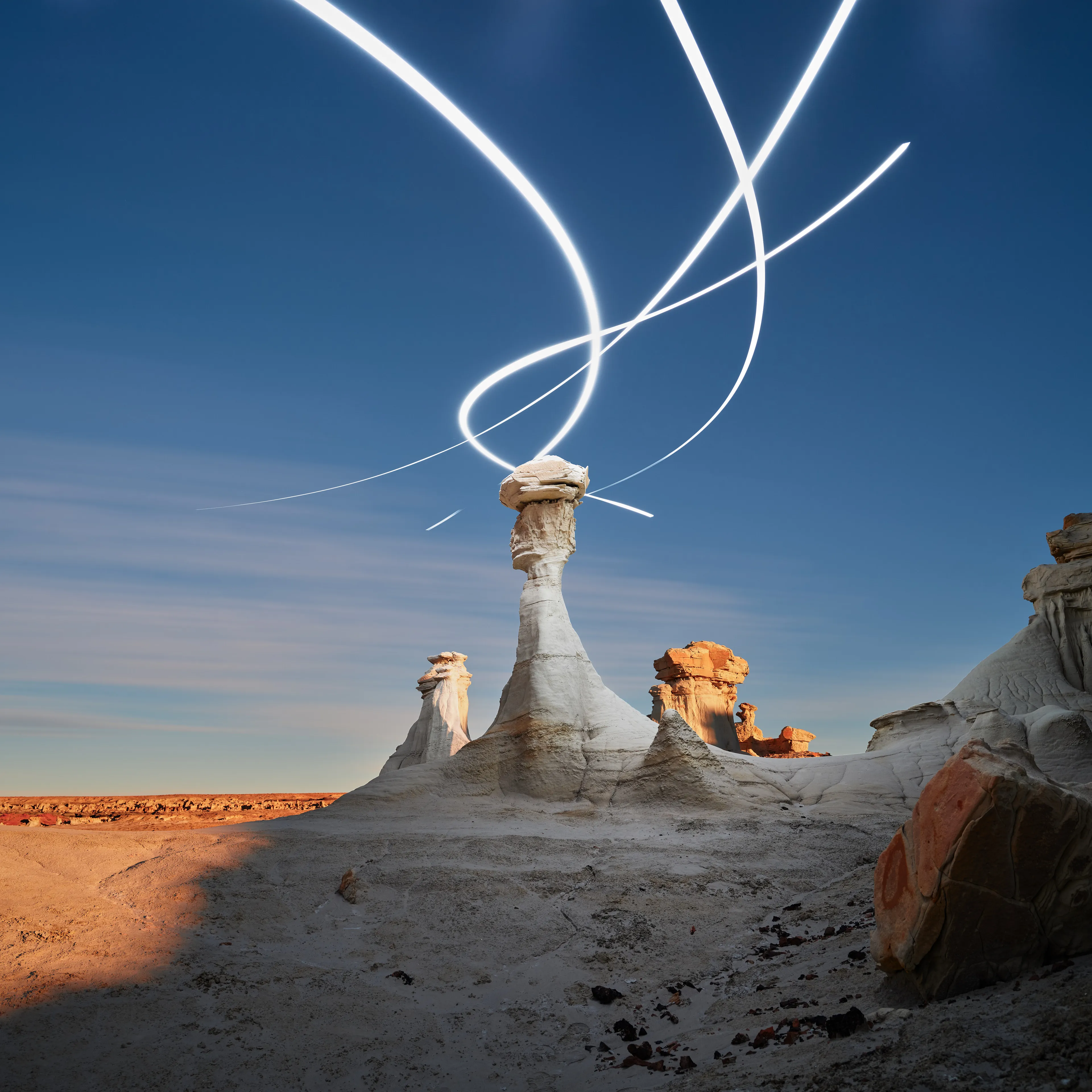 Aeroglyph Variations #25 by Reuben Wu

Aeroglyph Variations is a collection evolved from my Aeroglyphs body of work, created exclusively for Obscura Curated. 

Aeroglyphs explores my method of intervention in landscape photography. By using light carrying drones and long exposure, I’m able to play a larger role in artistic expression all without leaving a trace on the scene.

This series was captured over the course of 20 hours in New Mexico, USA on Dec 12-13 2021. It shows the iterative processes and decisions I typically encounter during the creation of a final image, presented as a collection of 55 images. Compositionally, every image is the same, yet in attributes, every image is different. Time of day, light formations (glyphs) and other traits vary within the series to result in a spectrum of unique possibilities.

Taking inspiration from generative art and groundbreaking photo projects such as Carpoolers (Alejandro Cartagena), this project examines the notion of the photographer as algorithm; the code that creates and which ultimately derives from our unique programming of life experiences.
Reuben Wu's OpenSea: https://opensea.io/itsreuben?tab=created

Edition: 1 of 1

Commissioned by Obscura