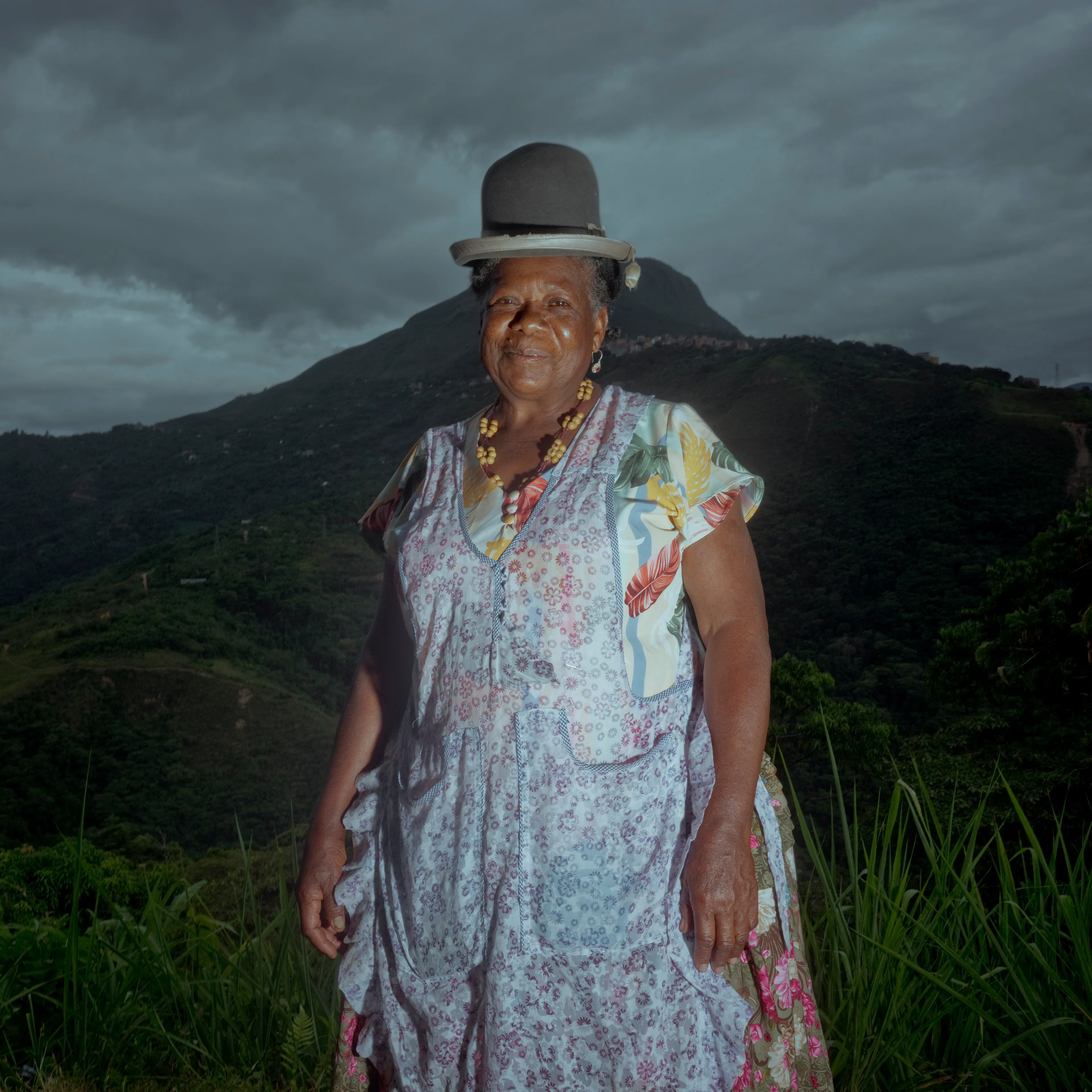 The Royal Pinedo #23 by Cristina de Middel

In the tropical region of Los Yungas in Bolivia, surrounded by coca plantations, Cristina De Middel has encountered the story of a King. His name is Julio Pinedo. Julio is a descendant of prince Uchicho, the King of the Kikongo tribe that arrived from the Congo in 1820. This collection will document the daily life of a quite unusual king, recognizing his legacy and the oral tradition that remains after 3 generations. The story will show how this legacy plays out within the the current problematic coca industry in the country, which is still one of Bolivia's biggest agricultural productions.

Edition: 1 of 1

Commissioned by Obscura