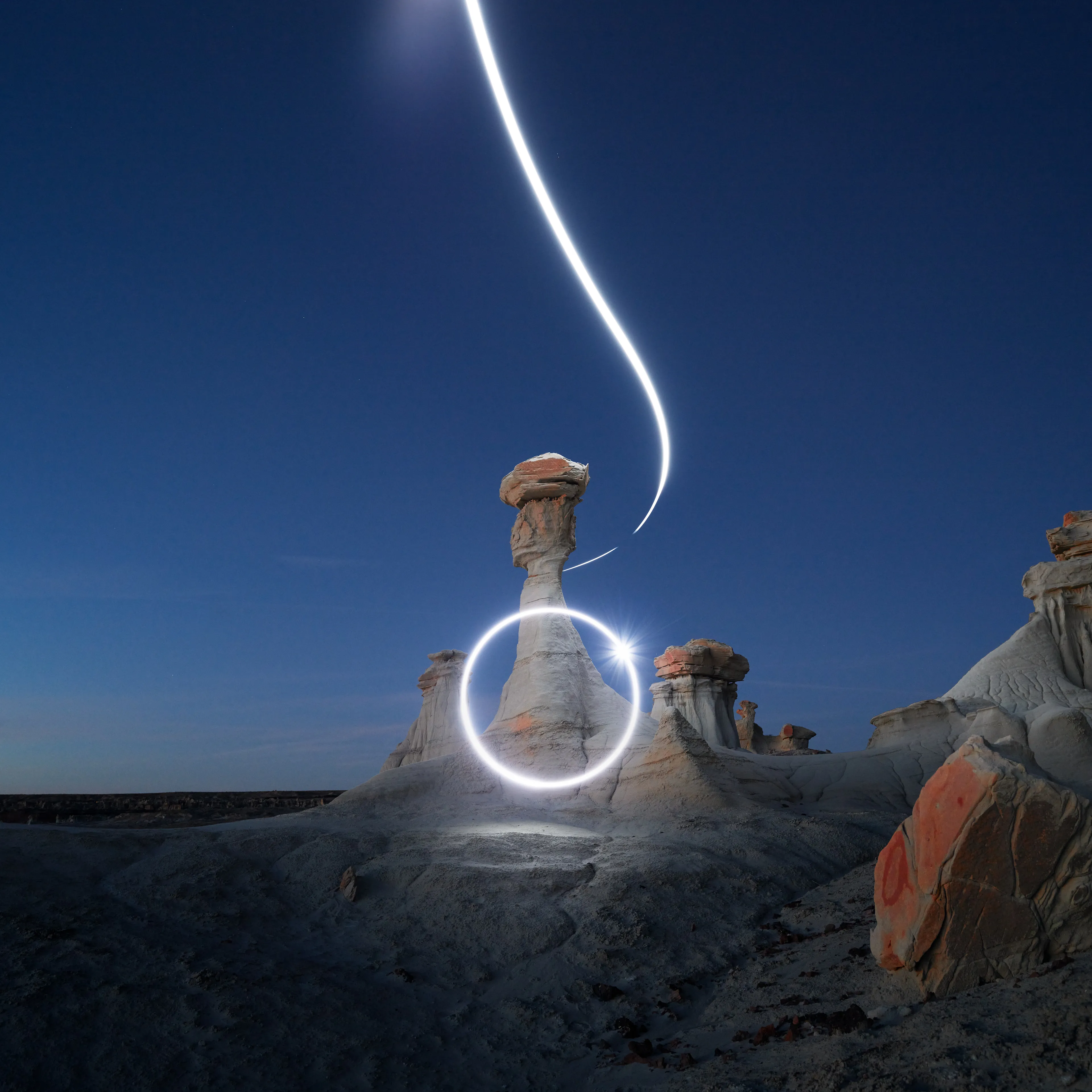 Aeroglyph Variations #4 by Reuben Wu

Aeroglyph Variations is a collection evolved from my Aeroglyphs body of work, created exclusively for Obscura Curated. 

Aeroglyphs explores my method of intervention in landscape photography. By using light carrying drones and long exposure, I’m able to play a larger role in artistic expression all without leaving a trace on the scene.

This series was captured over the course of 20 hours in New Mexico, USA on Dec 12-13 2021. It shows the iterative processes and decisions I typically encounter during the creation of a final image, presented as a collection of 55 images. Compositionally, every image is the same, yet in attributes, every image is different. Time of day, light formations (glyphs) and other traits vary within the series to result in a spectrum of unique possibilities.

Taking inspiration from generative art and groundbreaking photo projects such as Carpoolers (Alejandro Cartagena), this project examines the notion of the photographer as algorithm; the code that creates and which ultimately derives from our unique programming of life experiences.
Reuben Wu's OpenSea: https://opensea.io/itsreuben?tab=created

Edition: 1 of 1

Commissioned by Obscura