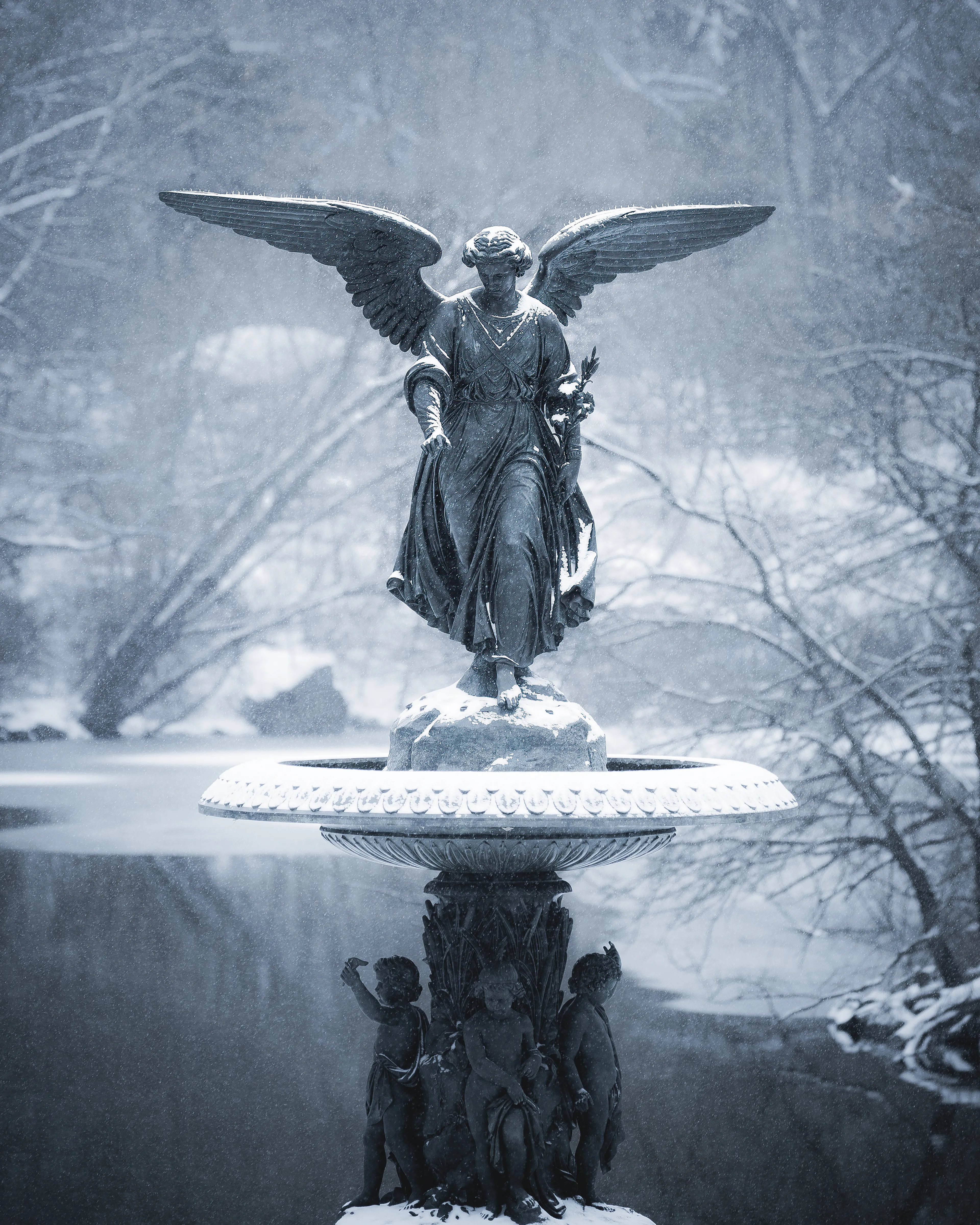 In the heart of a restless city, the Angel of the Waters offers a moment of stillness; wings outstretched not in flight, but in quiet reassurance, reminding us that peace can be found no matter the season.