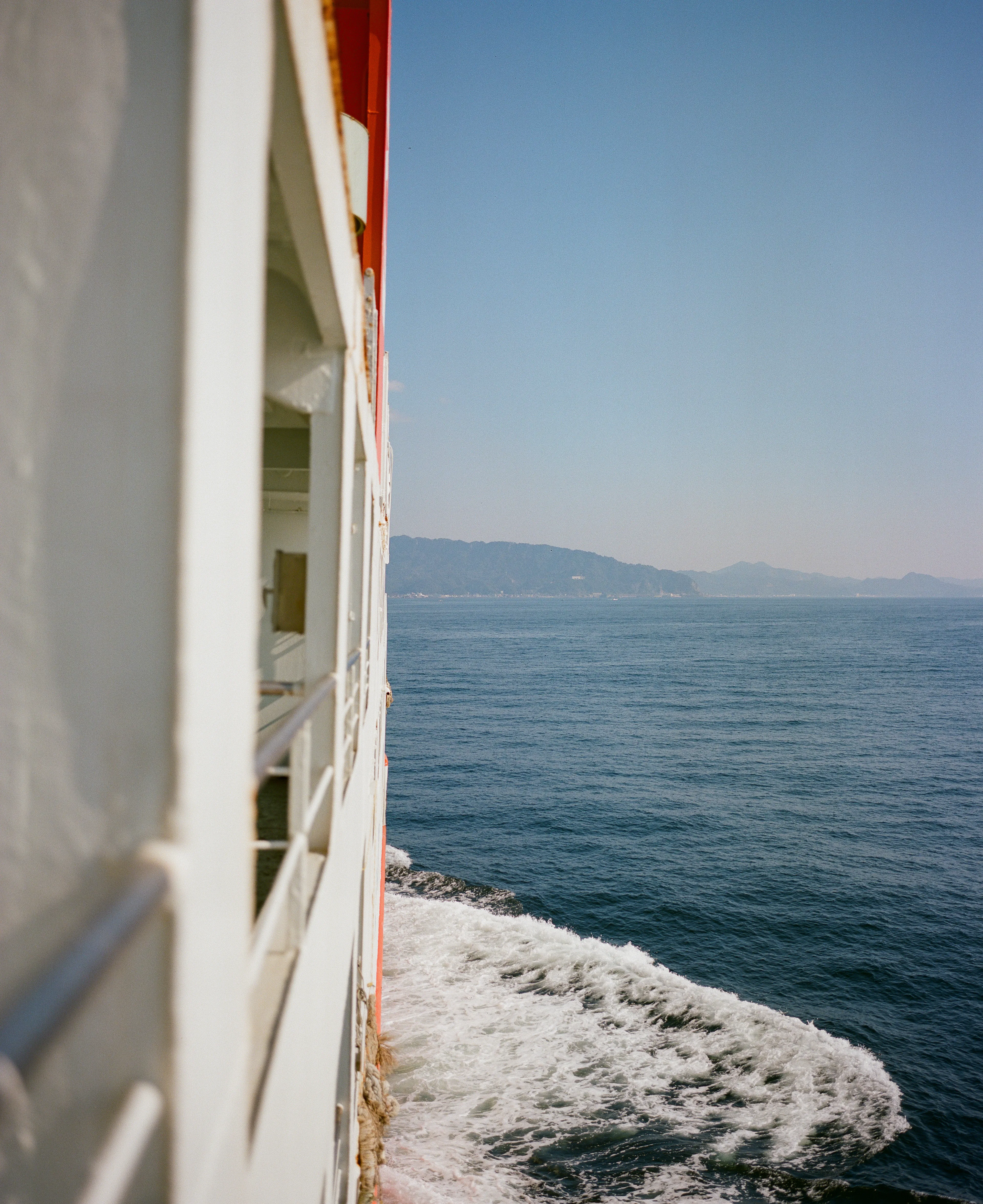 One of my favorite compositions to shoot is leaning over the side of a ferry, shooting vertically, to capture the ferry itself with a view of the destination ahead in the same frame. I love the symmetry it creates.

This image was shot on the Tokyo Wan Ferry, between Kurihama and Kanaya. The sun was shining, and the conditions on the water could not have been any better. It was an absolutely beautiful October day.

The Tokyo Wan Ferry was the last ferry I had the opportunity to travel on during my time Japan, and I think it ended being my favorite one. It was golden hour on our way back to Kurihama. I shot a ton of film during that 45-minute trip, but made sure to put the camera down and take in a few moments for myself as well.