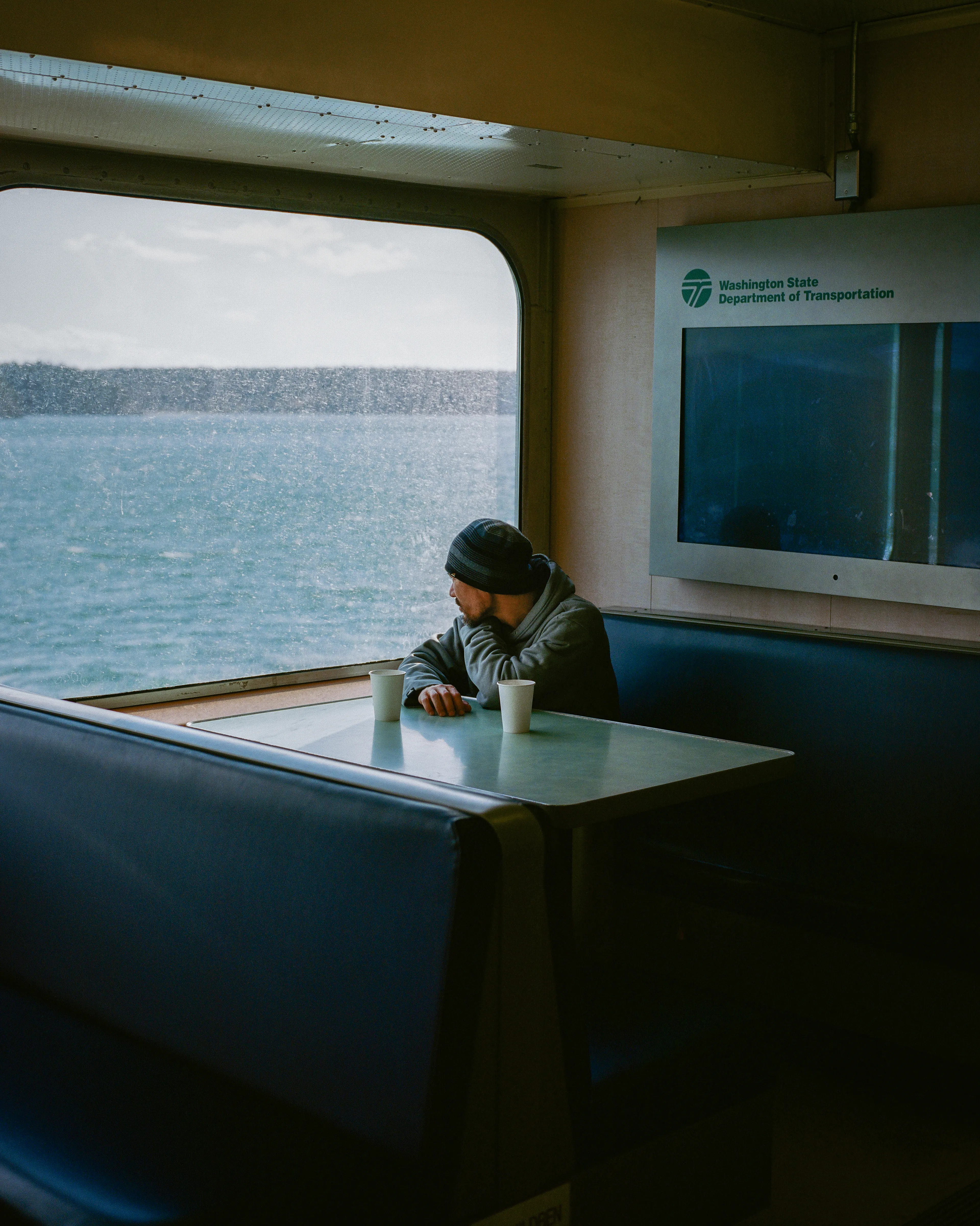 Looking through a dirty window on the ferry can be a metaphor for life itself - sometimes things may seem unclear or obscured, but there is still beauty and wonder to be found if we take the time to look for it.