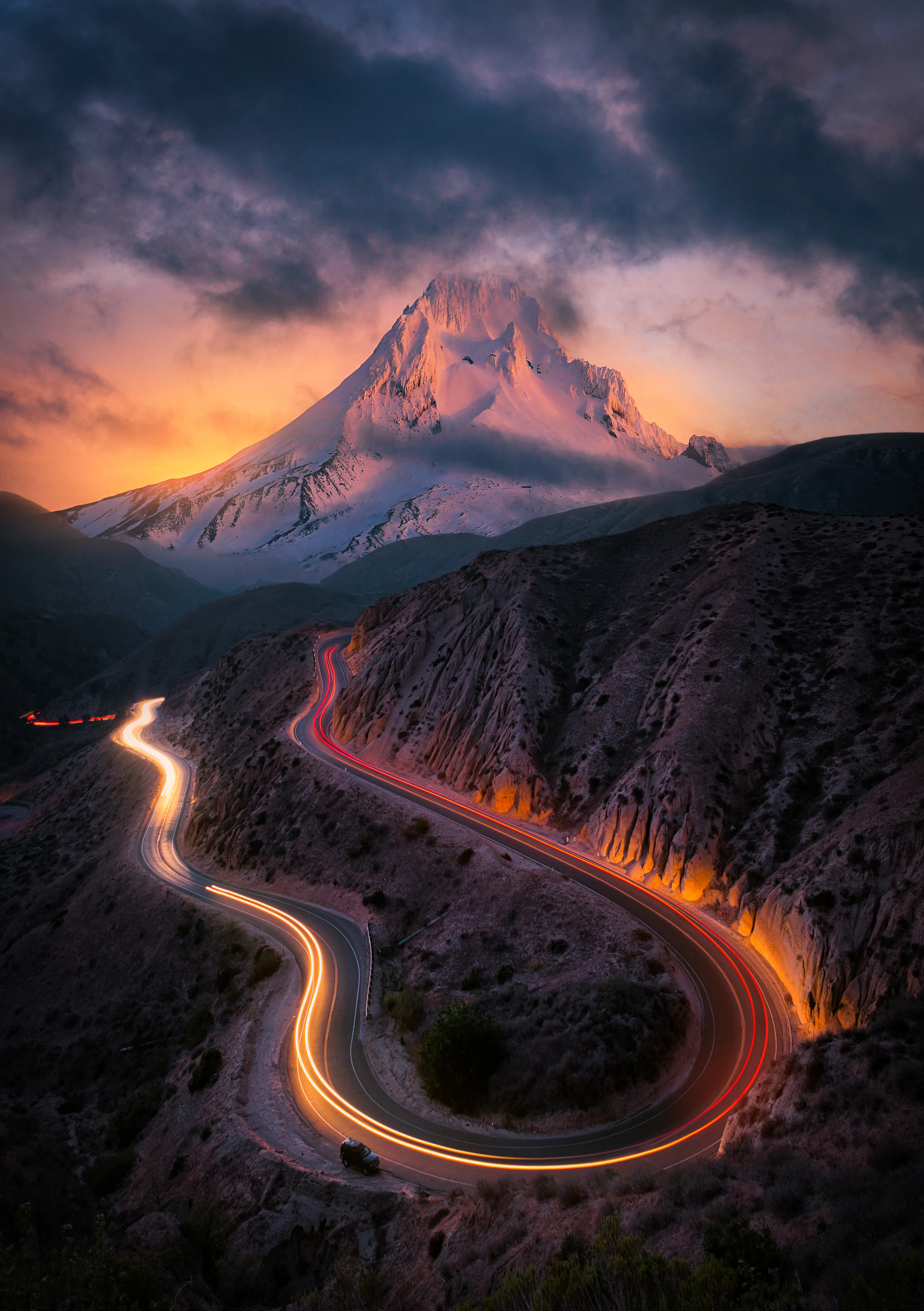 A composite image I created recently depicting a long exposure light trail of a car passing through beneath a large volcano off in the distance. One of my more creative images where I combine my photography with my creative vision for this final piece.

The image dimensions are 6816x4804 300dpi for maximum display resolution.