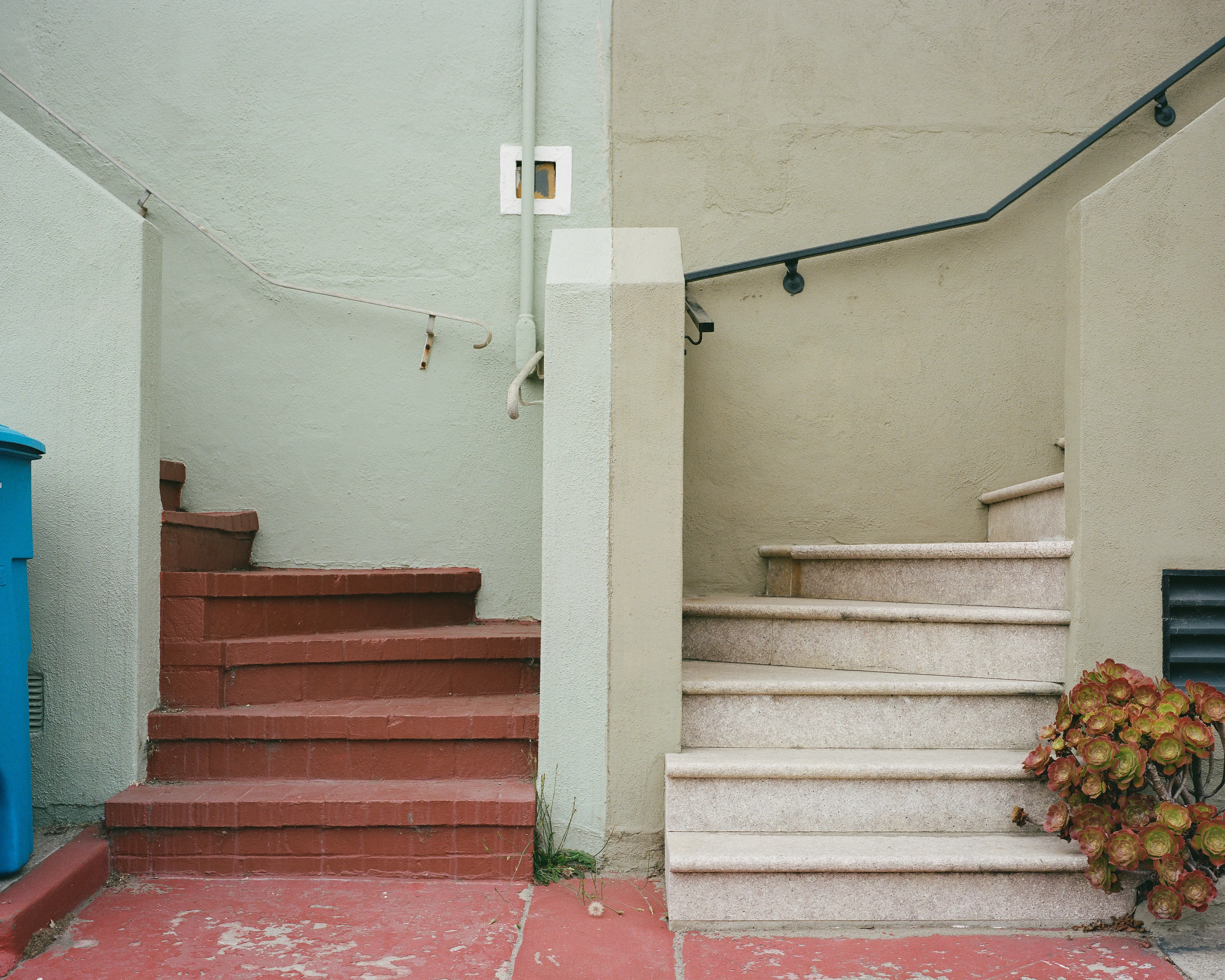"Come Together" is a limited series, showcasing the Outer Sunset in San Francisco, CA. This iconic neighborhood is full of homes painted in a wide range of colors. Every home has its own distinct identity, created through: decoration, textures, colors, and other personal touches.

While exploring the neighborhood, I came across a handful of homes with unique, back to back front steps. Both homes mirroring one another, offering their own personal touches, coming together to create a cohesive scene; simple, yet full of wonder.