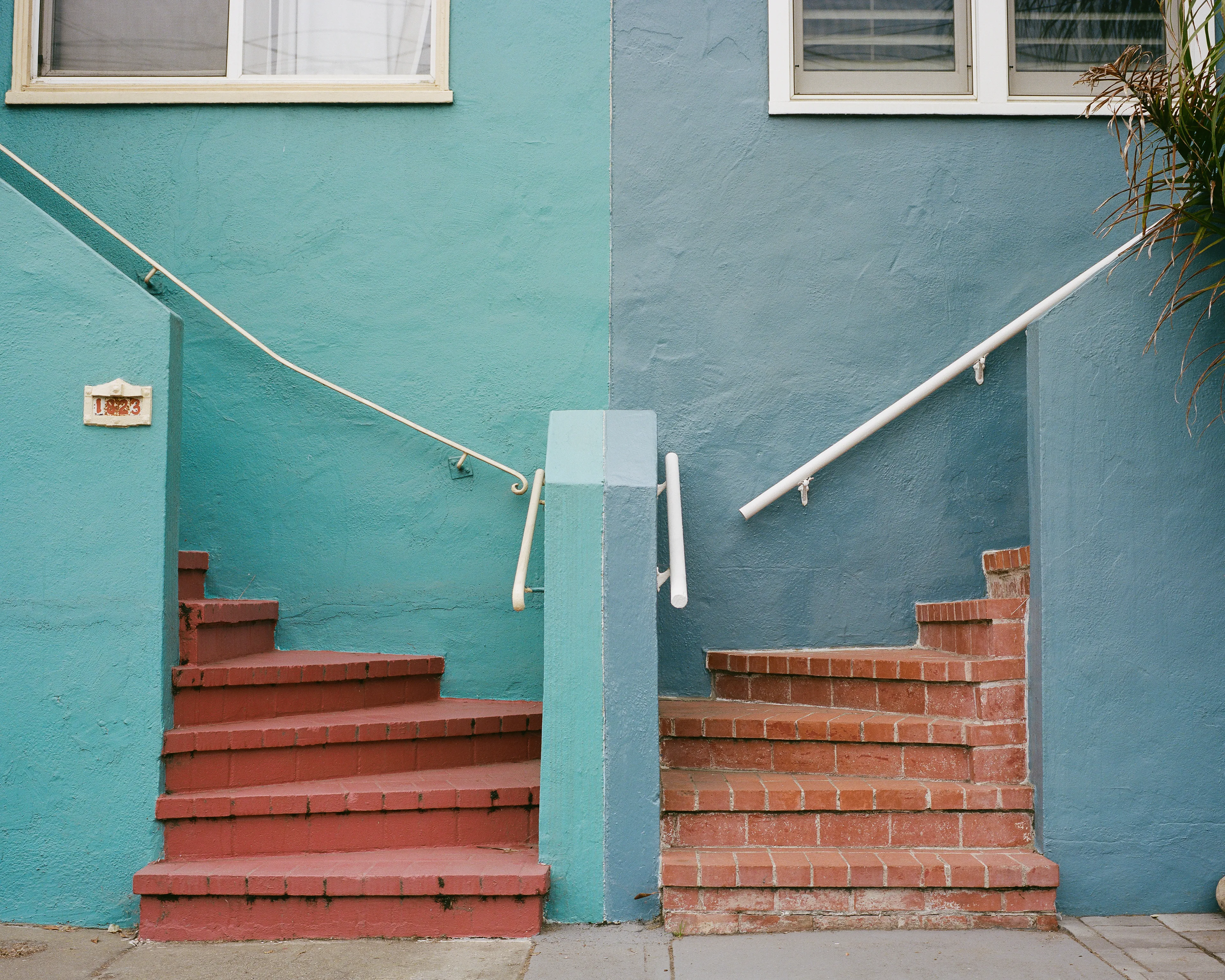 "Come Together" is a limited series, showcasing the Outer Sunset in San Francisco, CA. This iconic neighborhood is full of homes painted in a wide range of colors. Every home has its own distinct identity, created through: decoration, textures, colors, and other personal touches.

While exploring the neighborhood, I came across a handful of homes with unique, back to back front steps. Both homes mirroring one another, offering their own personal touches, coming together to create a cohesive scene; simple, yet full of wonder.
