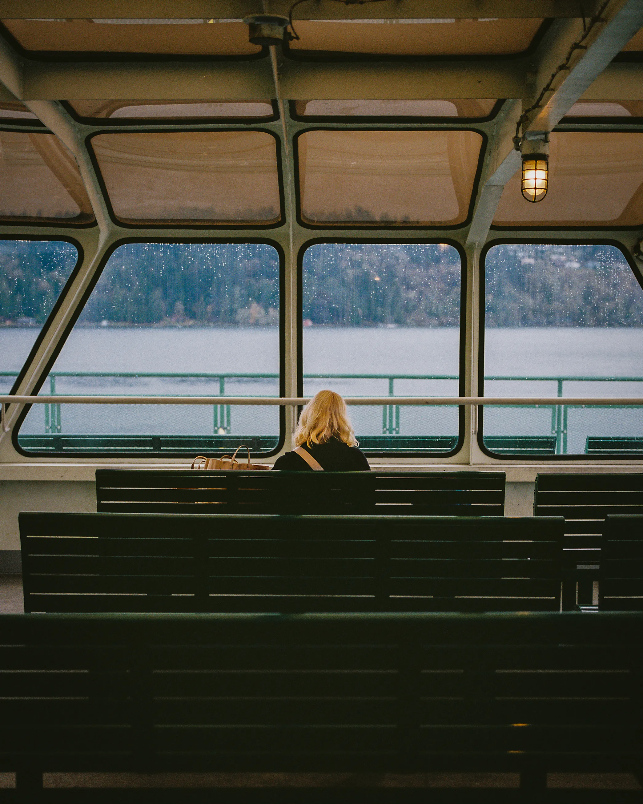 I don't know her name, and she doesn't know mine, but for these few moments we share the hush of travel, the rhythm of water, and the fleeting company of familiar strangers.