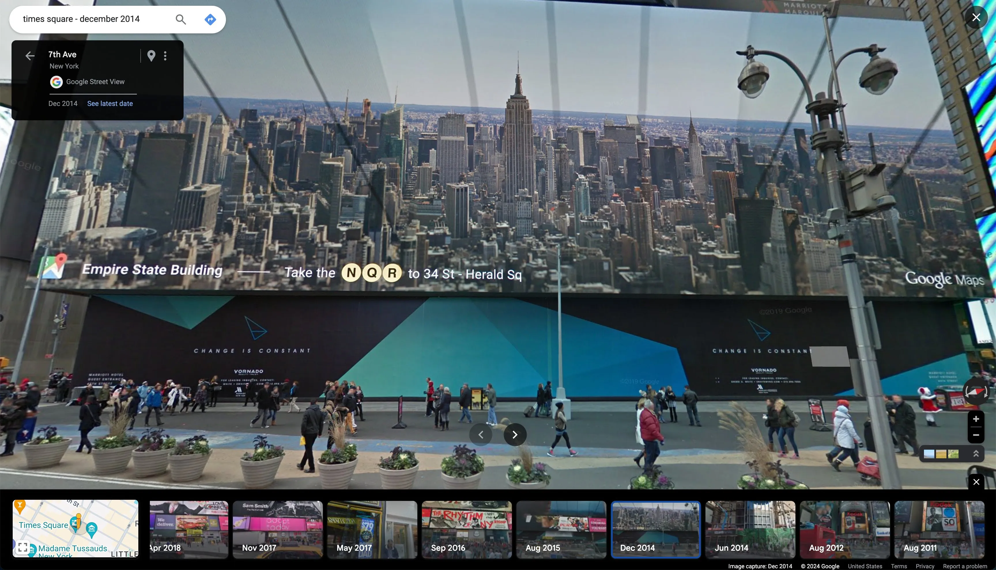 This conceptual artwork captures a meta-moment in digital cartography and urban experience. The piece presents a Google Street View image of Times Square in New York City from December 2014, creating a layered representation of how we perceive and navigate urban spaces in the digital age.

The composition is split between the iconic New York City skyline, dominated by the Empire State Building, and the street-level view of Times Square. In a clever twist, the foreground features a large Google Maps advertisement, creating a self-referential loop - we're viewing a Google Maps image that contains an advertisement for Google Maps itself.

The artwork juxtaposes the grandiosity of the NYC skyline with the bustling street level, where pedestrians navigate around planters and informational signs. The Google Maps interface elements frame the scene, reminding viewers of the digital mediation of this urban experience.

This piece in the series uniquely highlights the ubiquity of digital mapping in our daily lives, while also commenting on the commercialization of public spaces and the ways in which technology companies insert themselves into our perception of the world around us. It's a snapshot that encapsulates the intersection of physical and digital realms in modern city life.

so meta baby.
