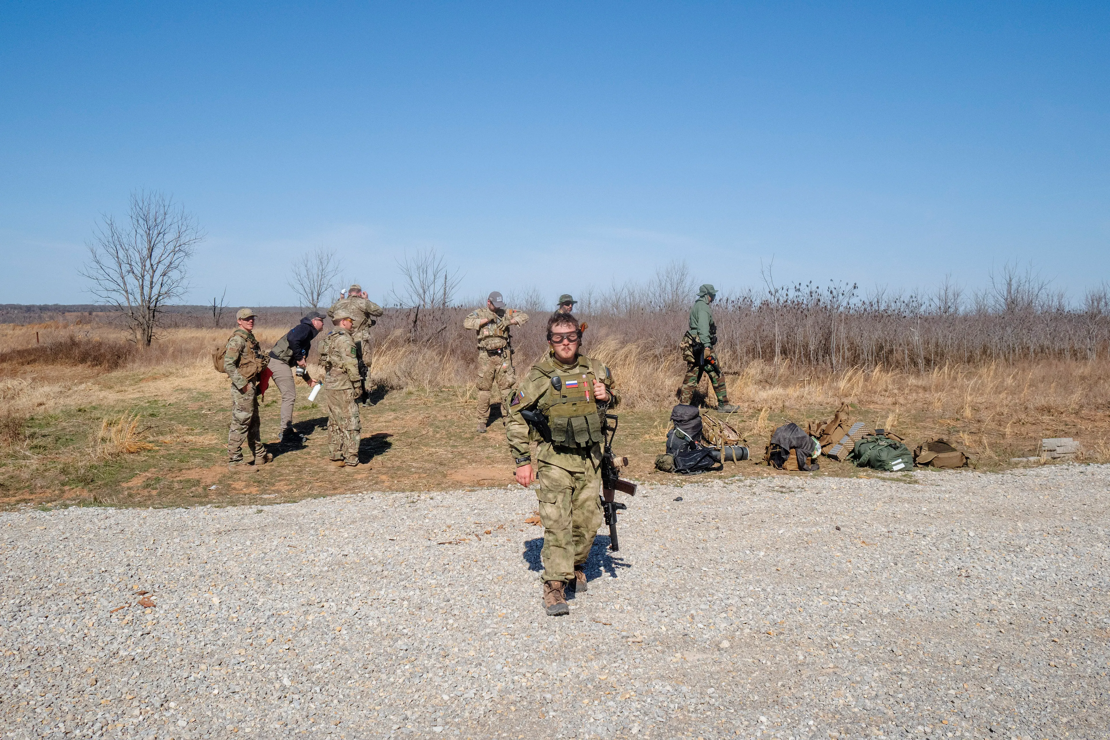 USA. Oklahoma. Overbrook. Battle Springs Ranch. March 2022. Final battle. Russian troops take a building from NATO forces and "win". Milsim, military simulation, airsoft weekend full immersion event. In a scenario where US and NATO troops, after loosing the battle of Kharkiv are trying to take back the Russian garrison town of Sarsk in the Rostov region close to the Ukrainian border. US FOR versus RUS FOR. Milsim West has been reenacting similar scenarios for a dozen of years and the similarity to current events is coincidental.
