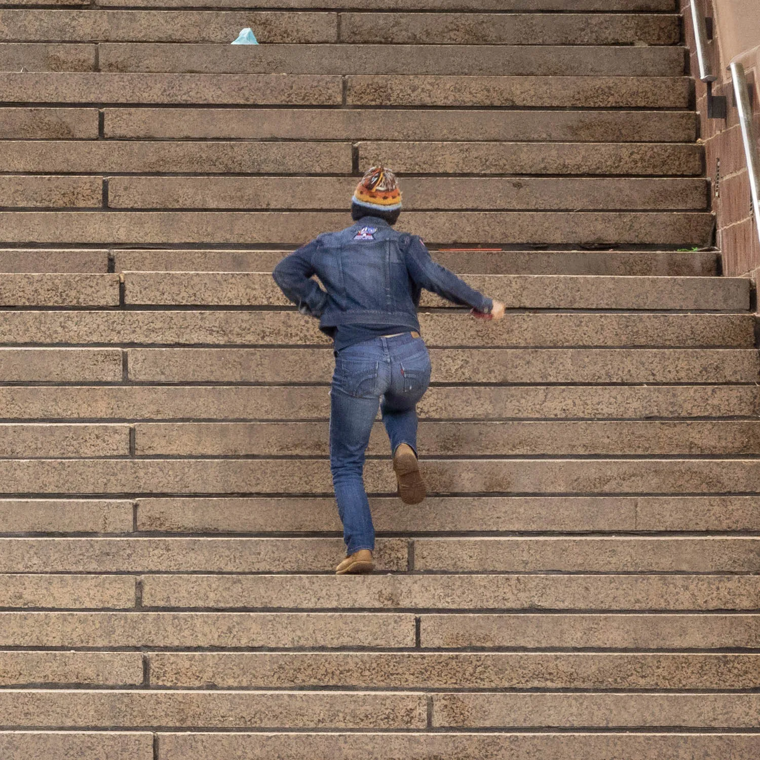 About an Hour: Down and Up (Government Center Steps, Boston, 3,120 exposures from 3:11 to 4:13 pm, March 20, 2022)

About an Hour is a series of photographs of a large staircase at Government Center, Boston. The project consists of two composite photos and 123 pendants derived from the main photo.  One main photo shows only people going down the stairs and facing the camera. The other main photo shows only people going up the stairs with their backs to the camera. The pendants show each figure in isolation, and they are named by the moment I tripped the shutter. The main composites make a generalization. The pendants show the particular.

Each figure in the photos remains in its real, original place. I change nothing. I simply decide what to keep in and what to leave out. The result is both a true record of an hour and an interpretation of it. The camera simply records what’s in front of it, and the moments couldn’t be more ordinary. But to my way of thinking, no one moment is ever typical or repeatable. Each moment holds a mystery, some poetry, some comedy--and lots of tragedy because it is gone as soon as it arrives. The camera can’t arrest the tragedy, of course, but it preserves the mystery.
