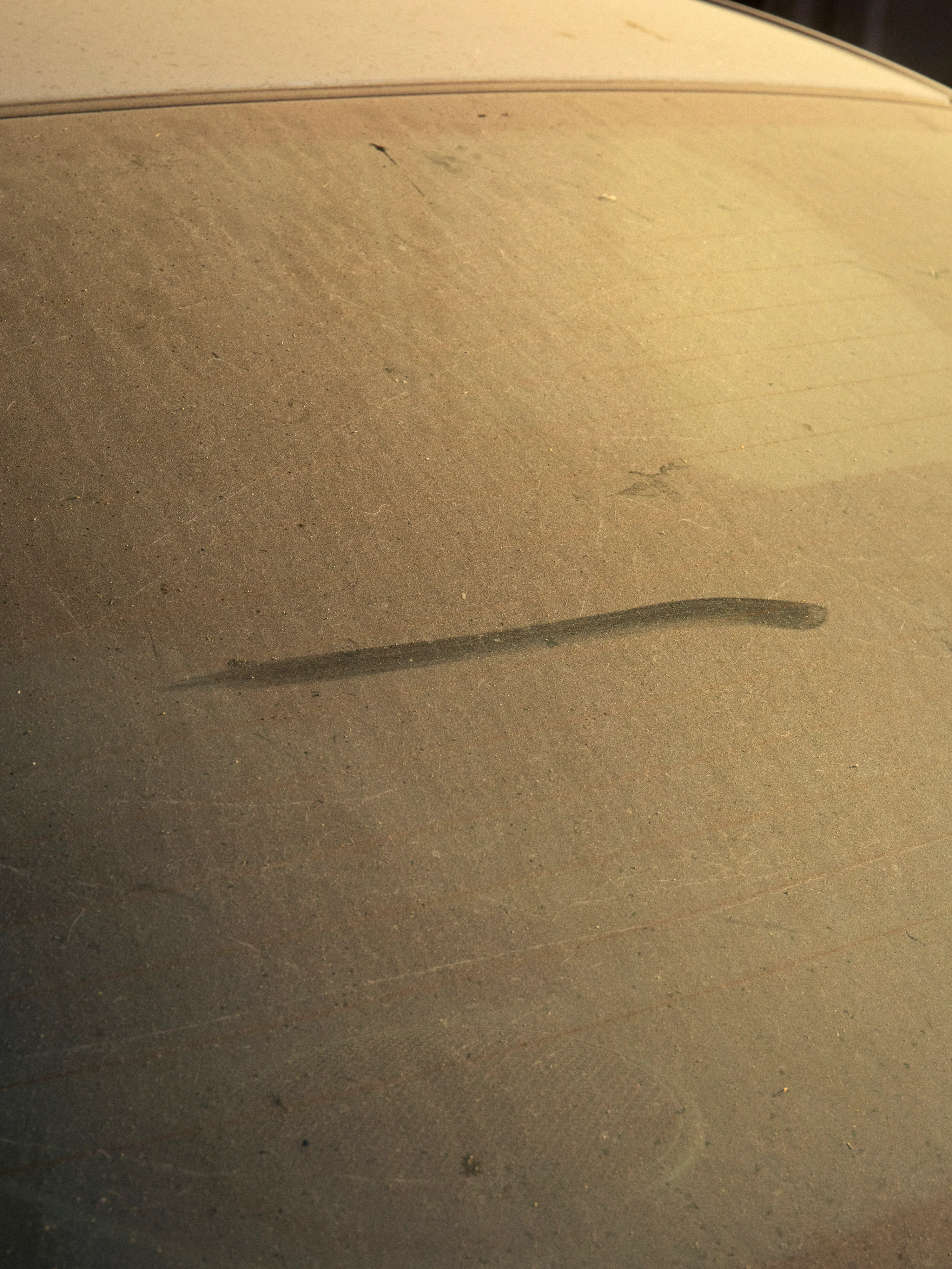 A mark on a windshield.