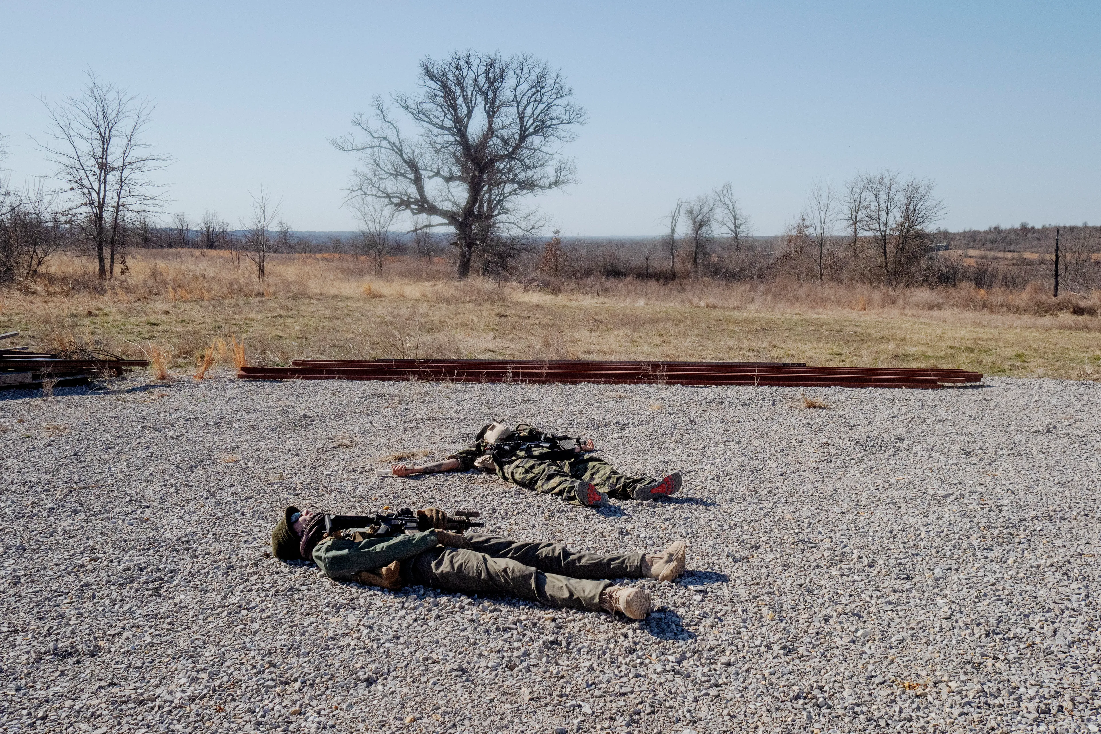 USA. Oklahoma. Overbrook. Battle Springs Ranch. March 2022. Final battle. Russian troops take a building from NATO forces and "win". Milsim, military simulation, airsoft weekend full immersion event. In a scenario where US and NATO troops, after loosing the battle of Kharkiv are trying to take back the Russian garrison town of Sarsk in the Rostov region close to the Ukrainian border. US FOR versus RUS FOR. Milsim West has been reenacting similar scenarios for a dozen of years and the similarity to current events is coincidental.