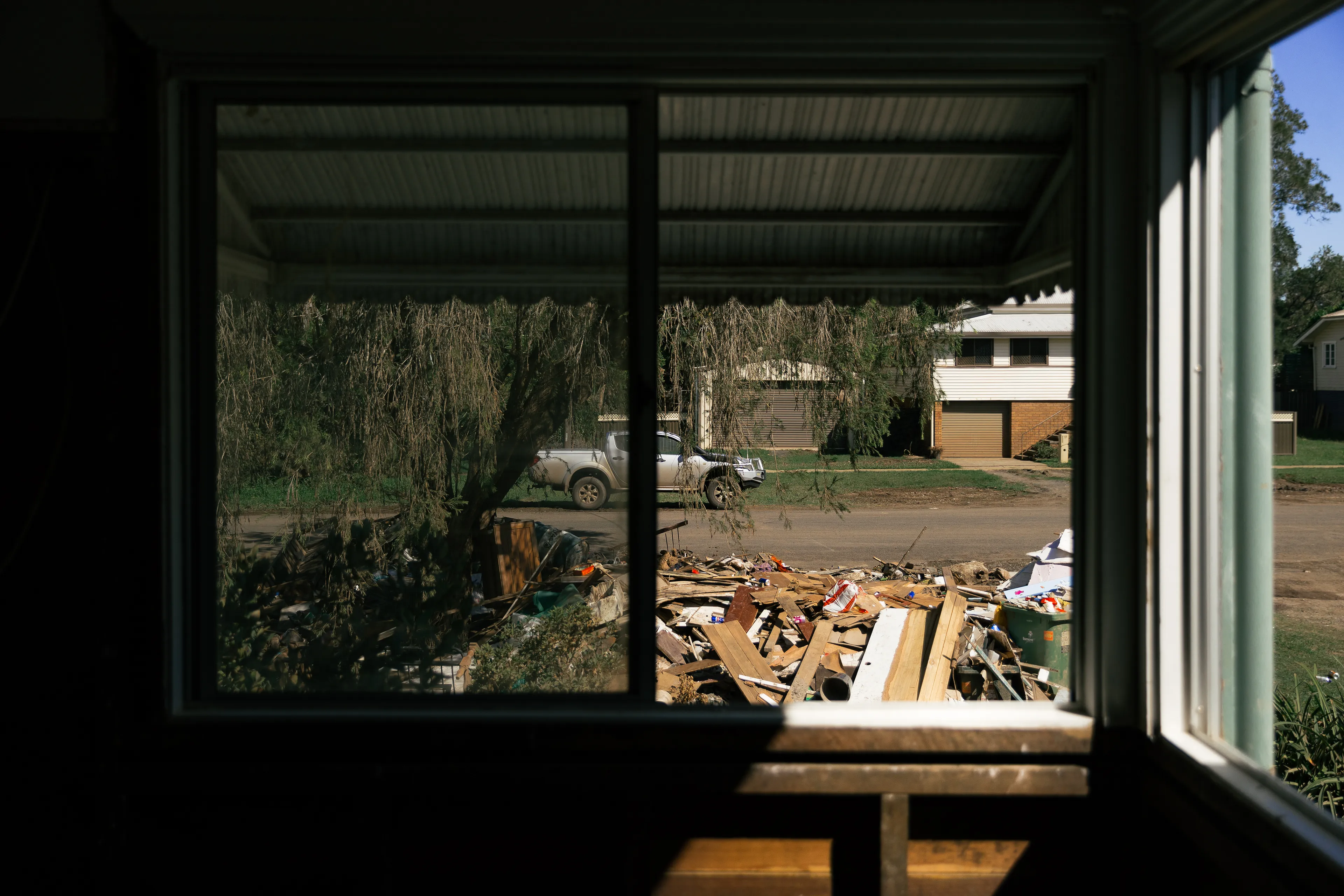 "After the Flood" is a photo story dedicated to the people of Lismore, a regional city in Northern New South Wales. In March 2022 torrential ongoing rain caused the river to reach the highest level in recorded history - 14.4m - flood waters inundated the city and peoples homes and local businesses. The catastropic event was declared a national emergency; thousands of people were displaced without homes to return to, and hundreds of businesses are unable to start over again, following a similar flood event only 5 years earlier, in 2017. 
Much like the rescue efforts were led by citizens, the community are "in this together", with much of the clean up effort being administered and supported by the residents of Lismore, and volunteers from out of town helping people rebuild their lives. 
