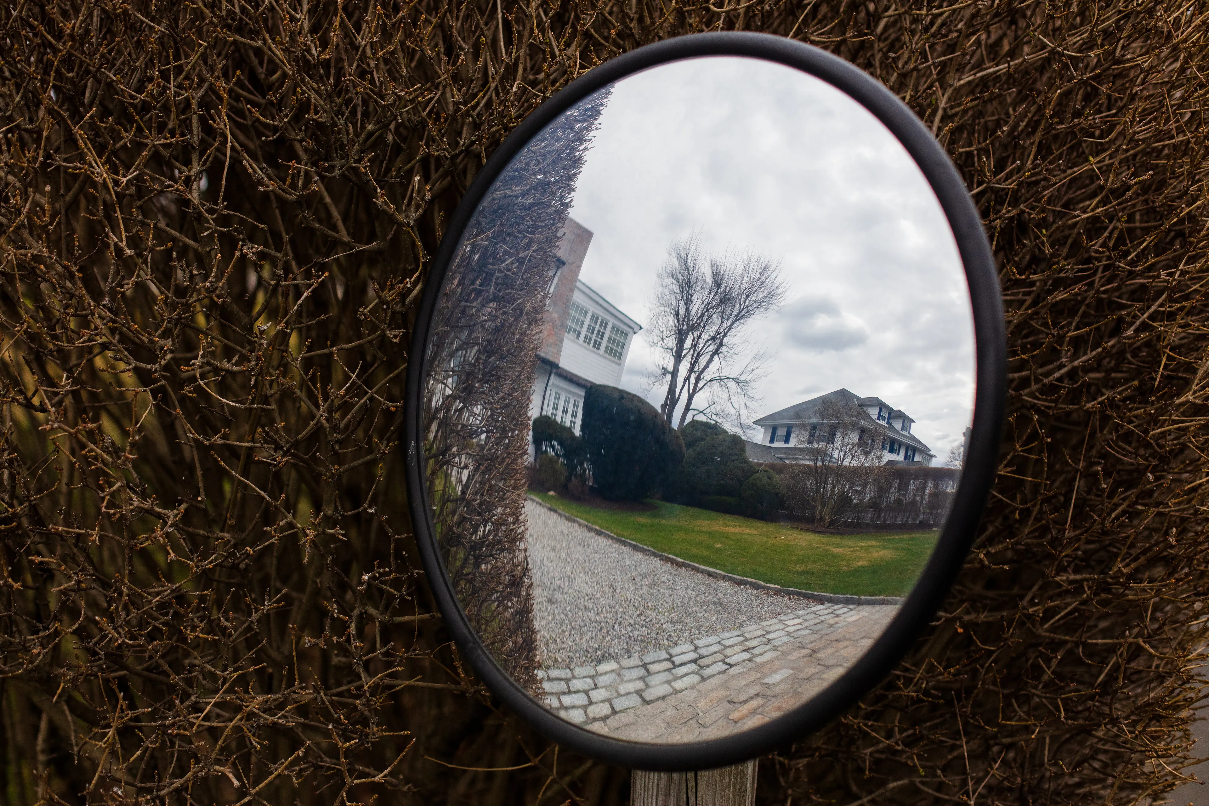 Greenwich, Connecticut, a suburb of New York City, is one of the wealthiest towns in the world. What remains of the original indigenous inhabitants of the land, while not invisible, can be hard to see. The land was commodified by settlers nearly four centuries ago. The native Siwanoy people were mistreated and removed from their land, but a friendly narrative of sharing of the land is used to justify the virtually infinite wealth of today’s inhabitants. Massive estates now sit on streets with indigenous names. Property owners bolt convex mirrors to trees to make sure they can see everything behind them clearly, to keep their expensive cars safe as they leave their wide driveways. But rearview vision can be distorted. These mirrors make everything look like a funhouse, and make it difficult to escape seeing one’s own reflection. 

In my first NFT project, I am reflecting on the perils of commodification in the context of what seems like the latest technology to encourage it. When property ownership moves from the ephemeral to the physical or from the physical to the ephemeral, what is lost? Is anything gained? For whom? What stories do we tell to justify our decisions, and what distorted mirrors do we employ to look back and feel safe?