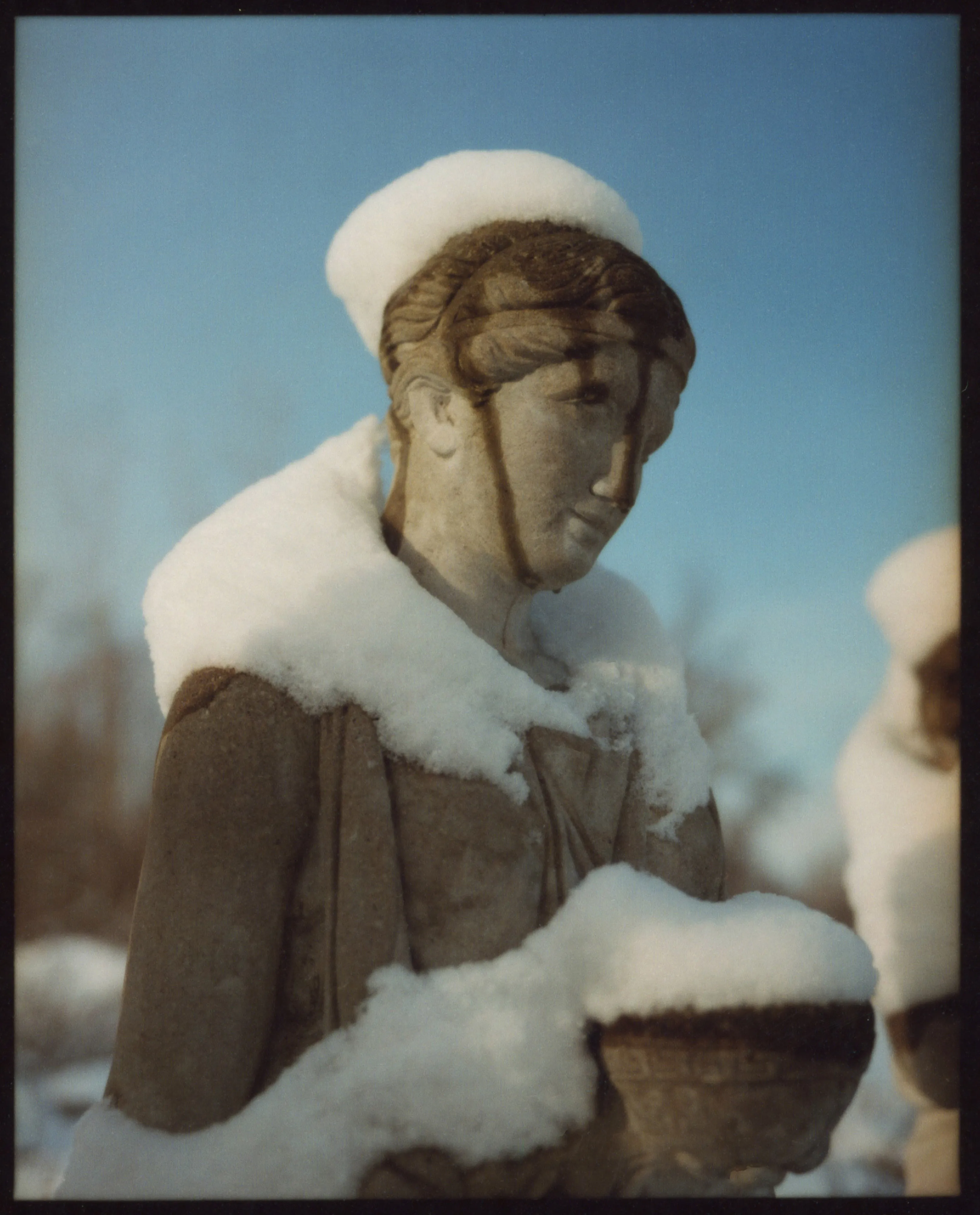 These pictures were made in and around Buffalo, New York, where I grew up. They were made on medium-format film, printed as analog contact sheets and then scanned on a flatbed scanner.  This process creates occasional dust, imperfections and a sense of softness to the image.