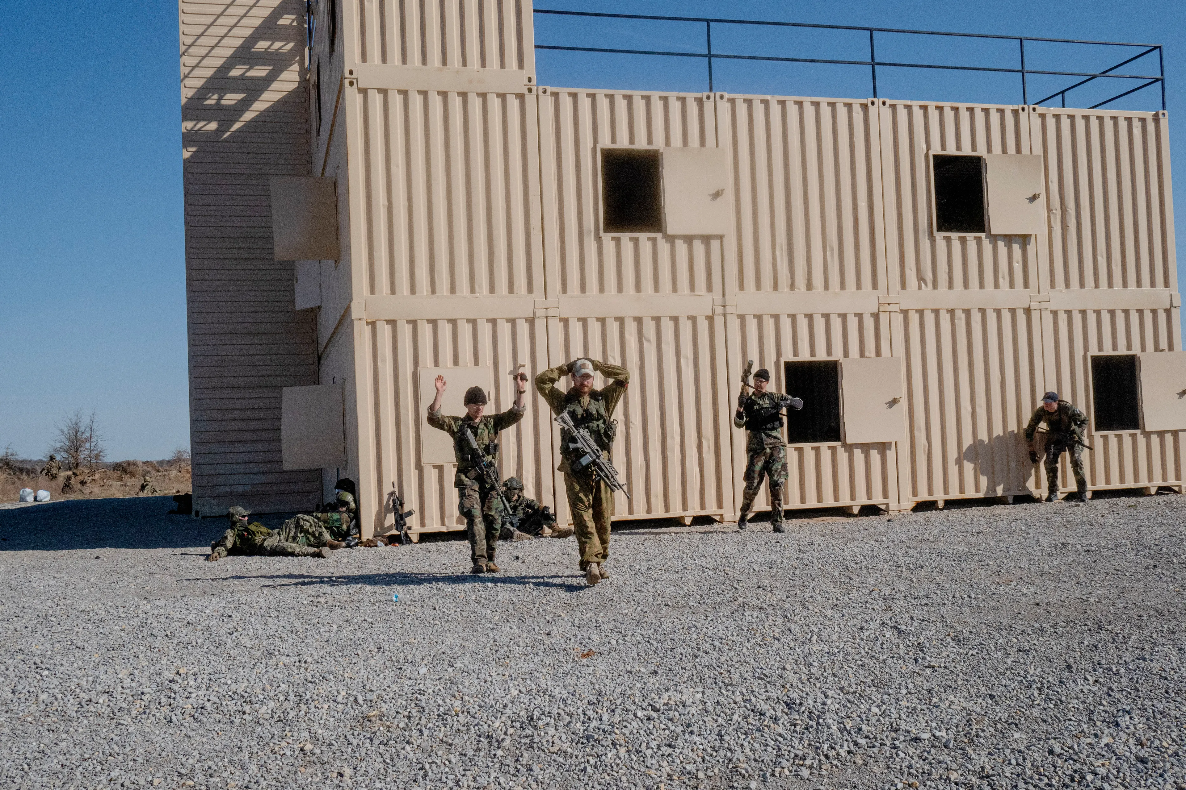 USA. Oklahoma. Overbrook. Battle Springs Ranch. March 2022. Final battle. Russian troops take a building from NATO forces and "win". Milsim, military simulation, airsoft weekend full immersion event. In a scenario where US and NATO troops, after loosing the battle of Kharkiv are trying to take back the Russian garrison town of Sarsk in the Rostov region close to the Ukrainian border. US FOR versus RUS FOR. Milsim West has been reenacting similar scenarios for a dozen of years and the similarity to current events is coincidental.
