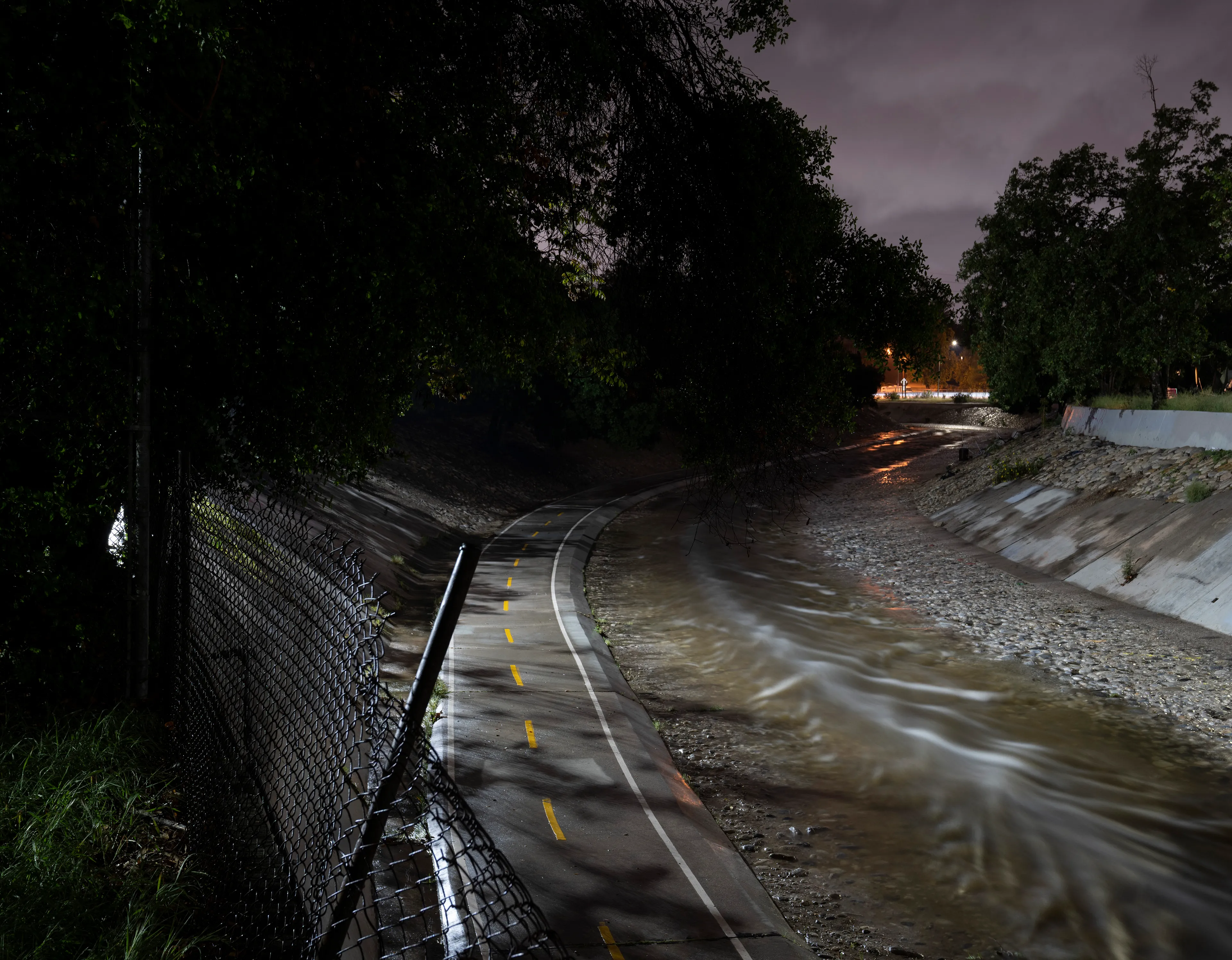 Echoing The World Today's homage to the Mid-20th Century, this collection draws inspiration from "The Pedestrian," a story by Ray Bradbury about a man who wanders city streets alone at night.

Photographing in a different Los Angeles neighborhood each night, people were often skeptical of my presence, drawing a parallel to experiences Bradbury had during his own nocturnal walks in Beverly Hills, which inspired him to write his story seventy-plus years ago.

One night, I decided to bring along Galaxy, my fawn-colored pug, and my presence became more innocuous. He unknowingly became instrumental in finding that unique quietness found only in L.A.'s lonely, dark corners.