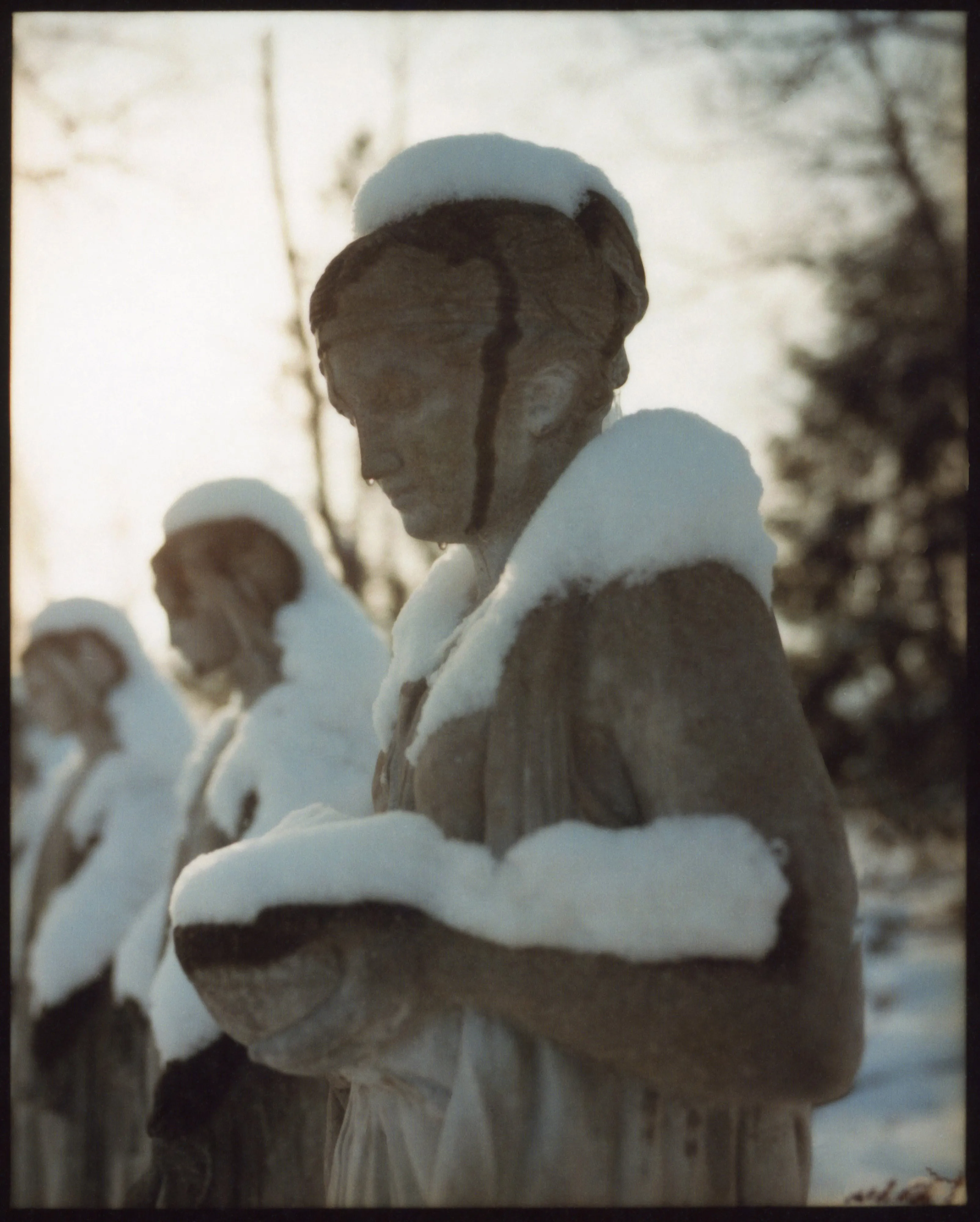 These pictures were made in and around Buffalo, New York, where I grew up. They were made on medium-format film, printed as analog contact sheets and then scanned on a flatbed scanner.  This process creates occasional dust, imperfections and a sense of softness to the image.