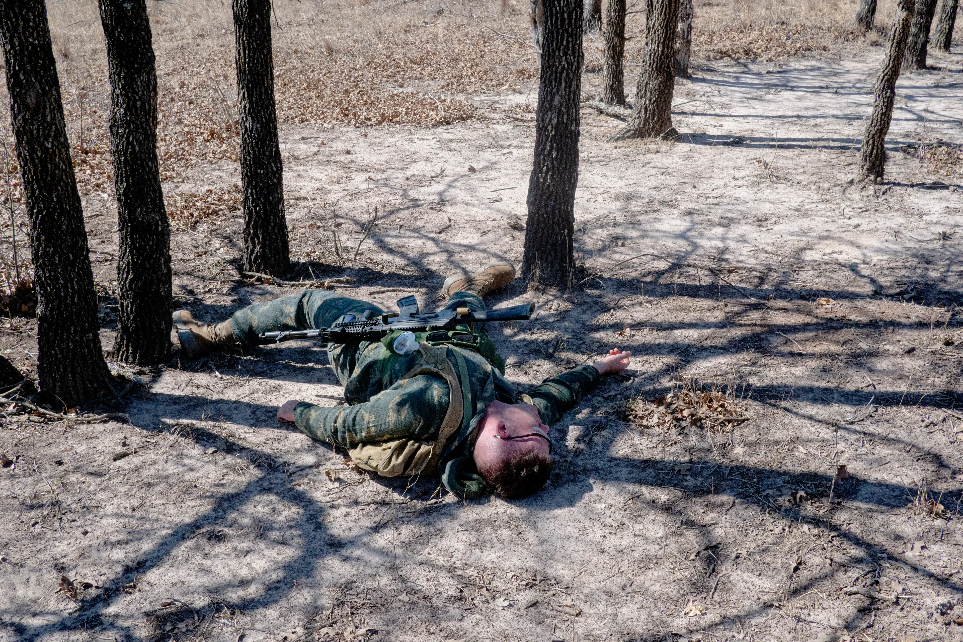 USA. Oklahoma. Overbrook. Battle Springs Ranch. March 2022. Battle between NATO and Russian forces. Killed and injured. Milsim, military simulation, airsoft weekend full immersion event. In a scenario where US and NATO troops, after loosing the battle of Kharkiv are trying to take back the Russian garrison town of Sarsk in the Rostov region close to the Ukrainian border. US FOR versus RUS FOR. Milsim West has been reenacting similar scenarios for a dozen of years and the similarity to current events is coincidental.
