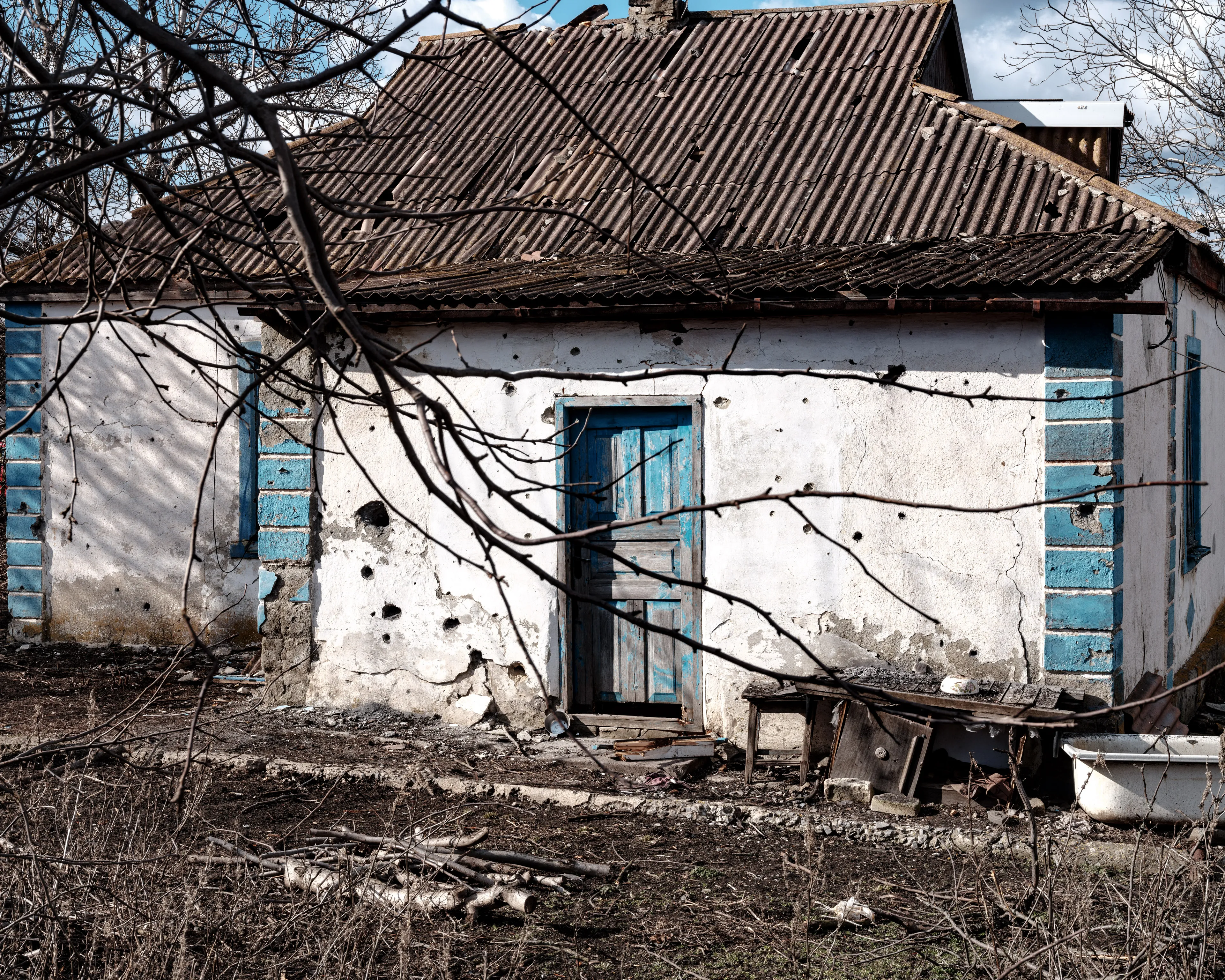 This selection of 100 images represents my trip to Ukraine from the 14th of February 2022 until the 24th of February 2022, the day the Russian army started its invasion. - The marks left by the artillery shrapnel that hit Anna Navka's house.