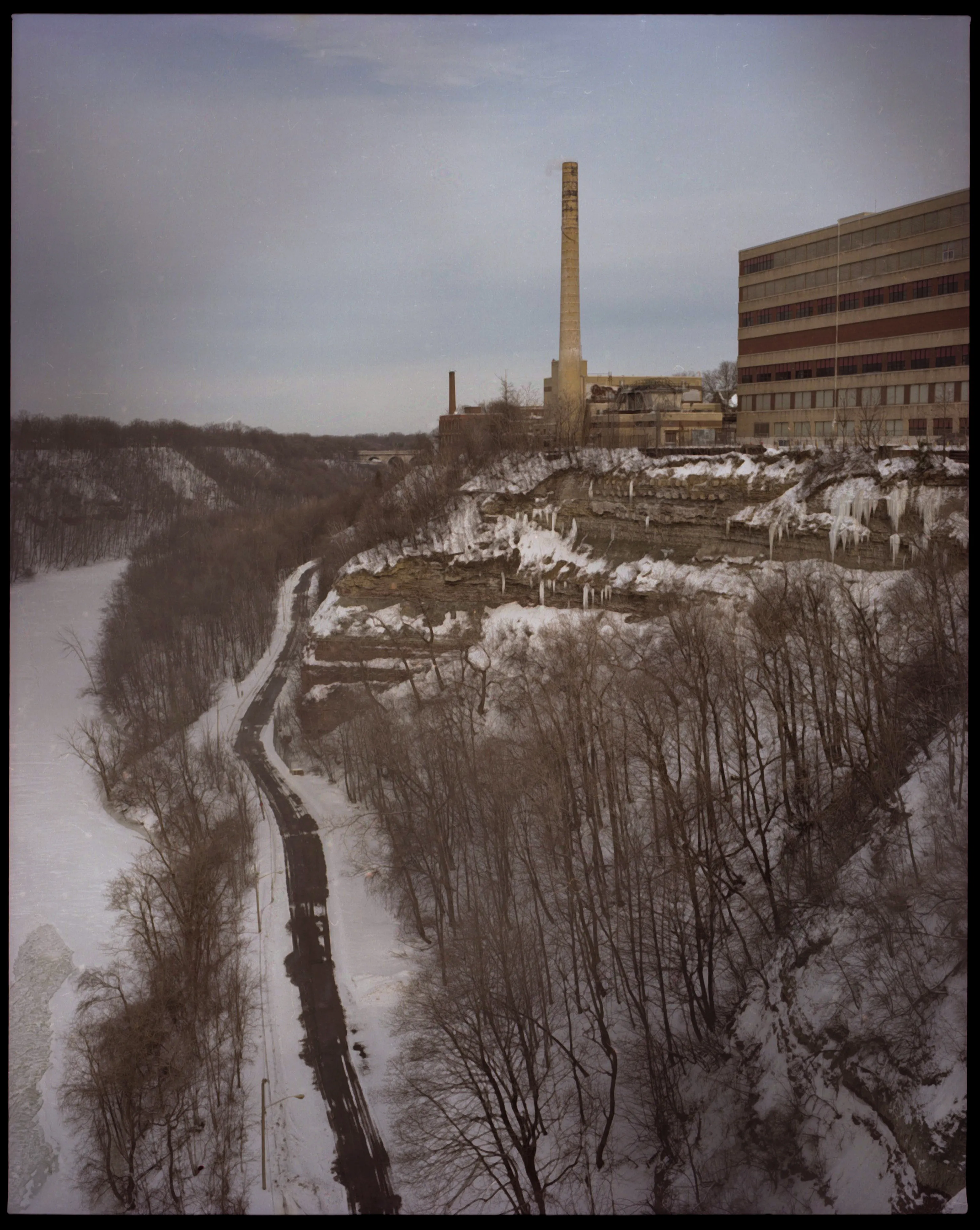 These pictures were made in and around Buffalo, New York, where I grew up. They were made on medium-format film, printed as analog contact sheets and then scanned on a flatbed scanner.  This process creates occasional dust, imperfections and a sense of softness to the image.