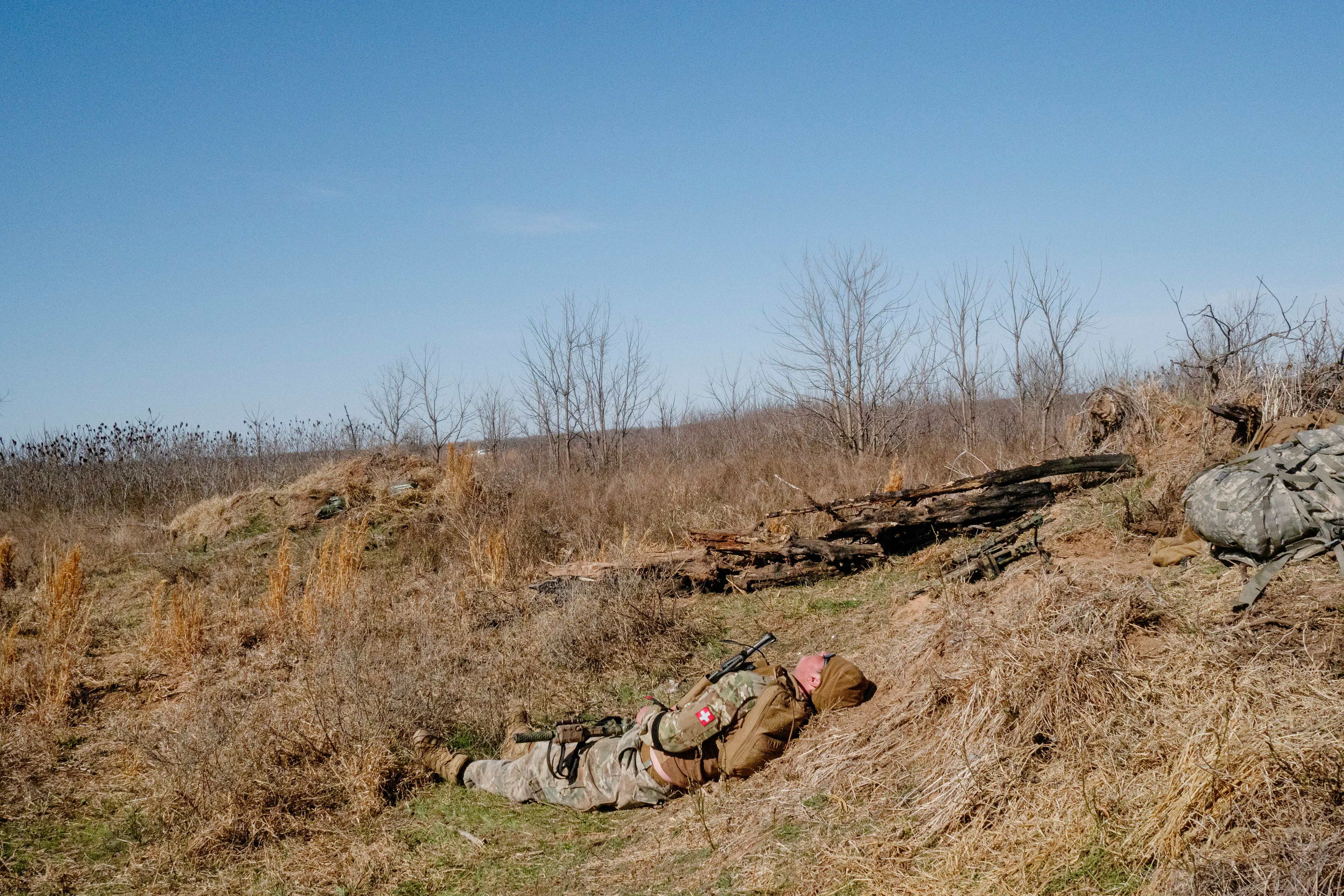 USA. Oklahoma. Overbrook. Battle Springs Ranch. March 2022. Final battle. Russian troops take a building from NATO forces and "win". Milsim, military simulation, airsoft weekend full immersion event. In a scenario where US and NATO troops, after loosing the battle of Kharkiv are trying to take back the Russian garrison town of Sarsk in the Rostov region close to the Ukrainian border. US FOR versus RUS FOR. Milsim West has been reenacting similar scenarios for a dozen of years and the similarity to current events is coincidental.