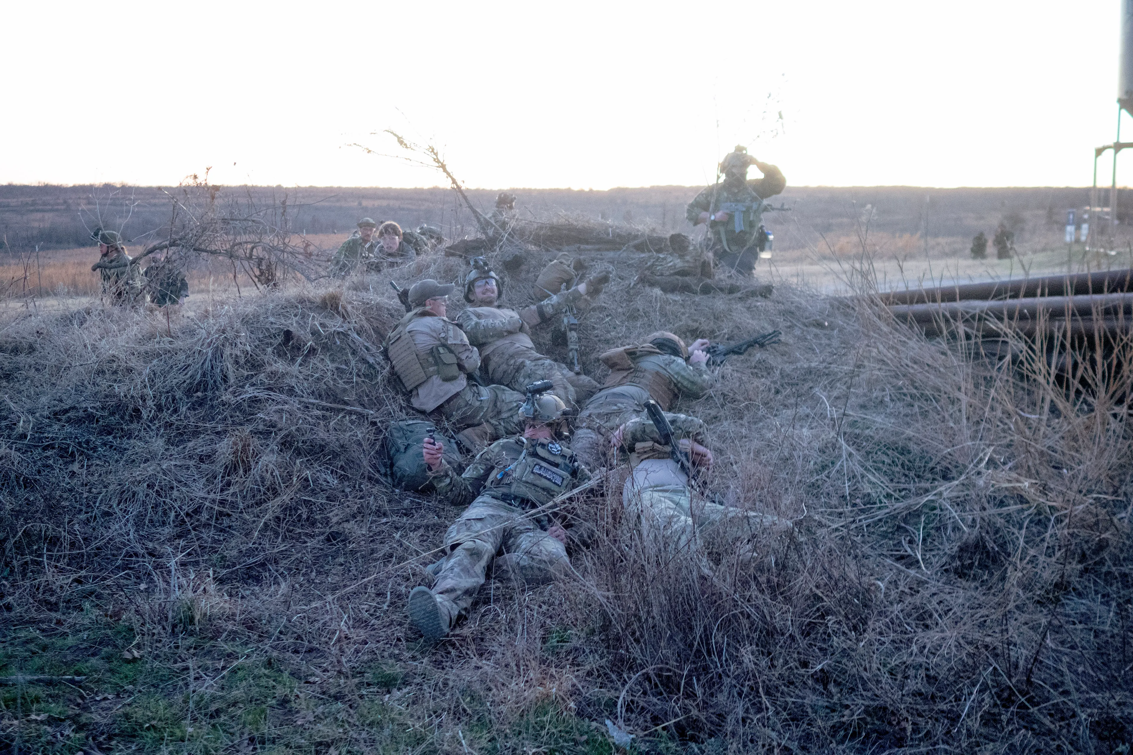 USA. Oklahoma. Overbrook. Battle Springs Ranch. March 2022. Battle between NATO and Russian forces. Killed and injured. Milsim, military simulation, airsoft weekend full immersion event. In a scenario where US and NATO troops, after loosing the battle of Kharkiv are trying to take back the Russian garrison town of Sarsk in the Rostov region close to the Ukrainian border. US FOR versus RUS FOR. Milsim West has been reenacting similar scenarios for a dozen of years and the similarity to current events is coincidental.