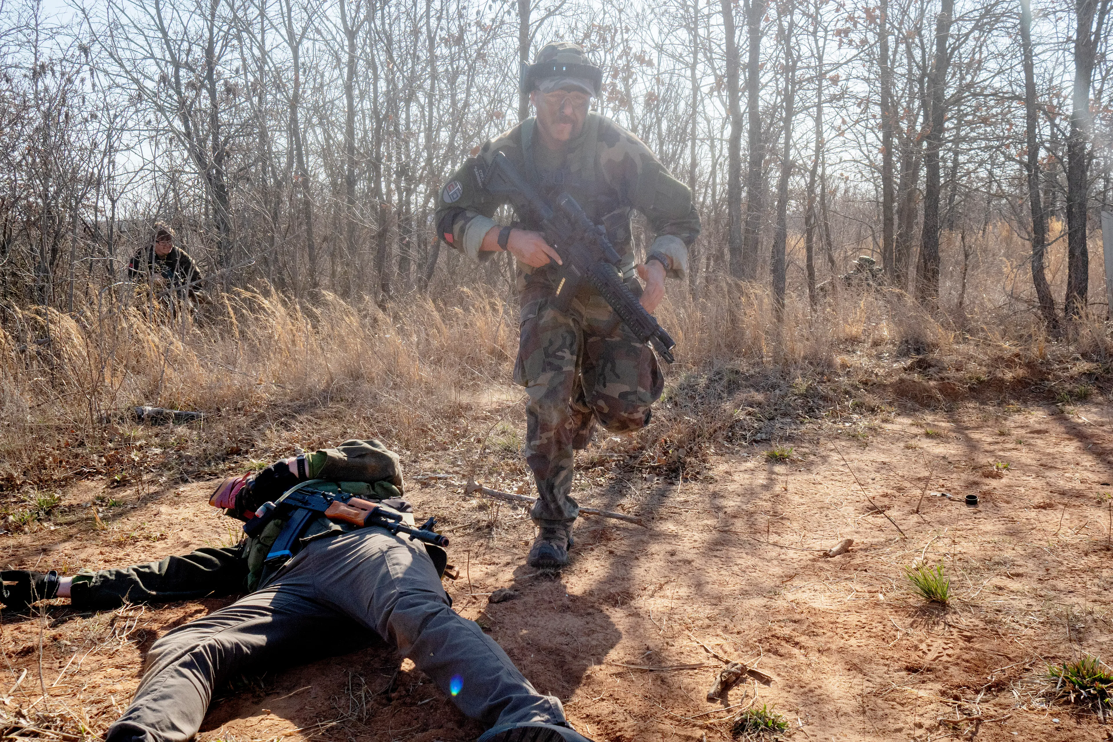 USA. Oklahoma. Overbrook. Battle Springs Ranch. March 2022. Final battle. Russian troops take a building from NATO forces and "win". Milsim, military simulation, airsoft weekend full immersion event. In a scenario where US and NATO troops, after loosing the battle of Kharkiv are trying to take back the Russian garrison town of Sarsk in the Rostov region close to the Ukrainian border. US FOR versus RUS FOR. Milsim West has been reenacting similar scenarios for a dozen of years and the similarity to current events is coincidental.