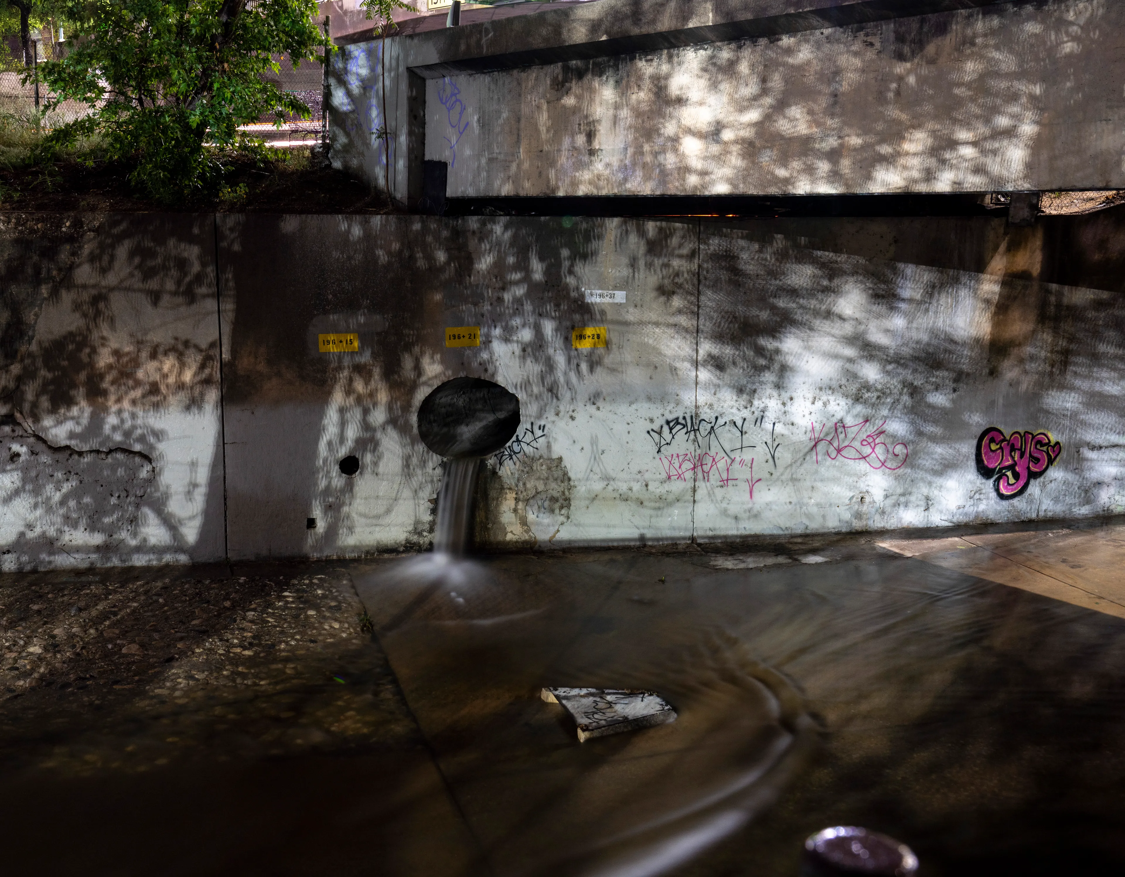 Echoing The World Today's homage to the Mid-20th Century, this collection draws inspiration from "The Pedestrian," a story by Ray Bradbury about a man who wanders city streets alone at night.

Photographing in a different Los Angeles neighborhood each night, people were often skeptical of my presence, drawing a parallel to experiences Bradbury had during his own nocturnal walks in Beverly Hills, which inspired him to write his story seventy-plus years ago.

One night, I decided to bring along Galaxy, my fawn-colored pug, and my presence became more innocuous. He unknowingly became instrumental in finding that unique quietness found only in L.A.'s lonely, dark corners.