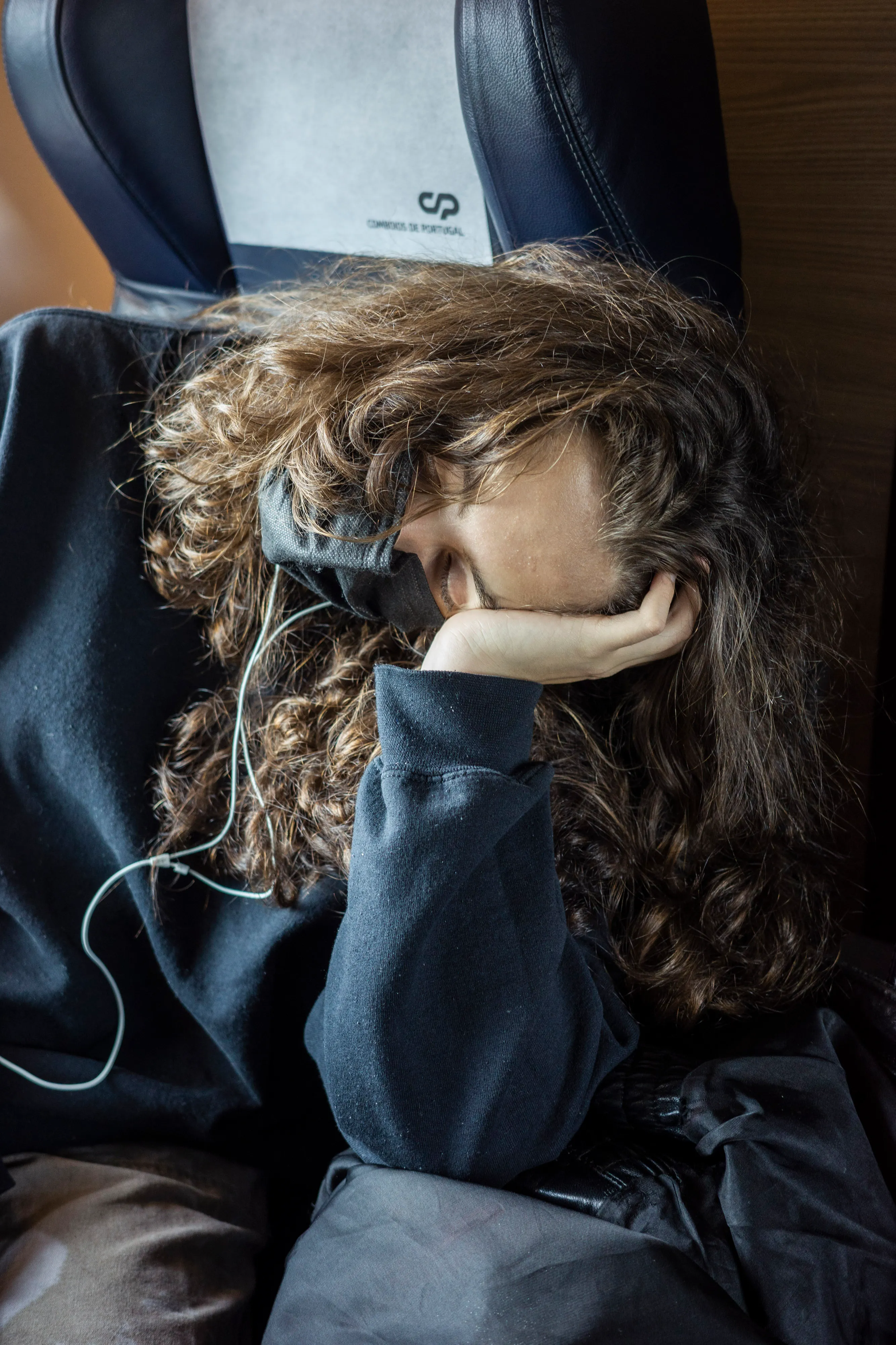 Cat sleeping on the Train Ride to Porto