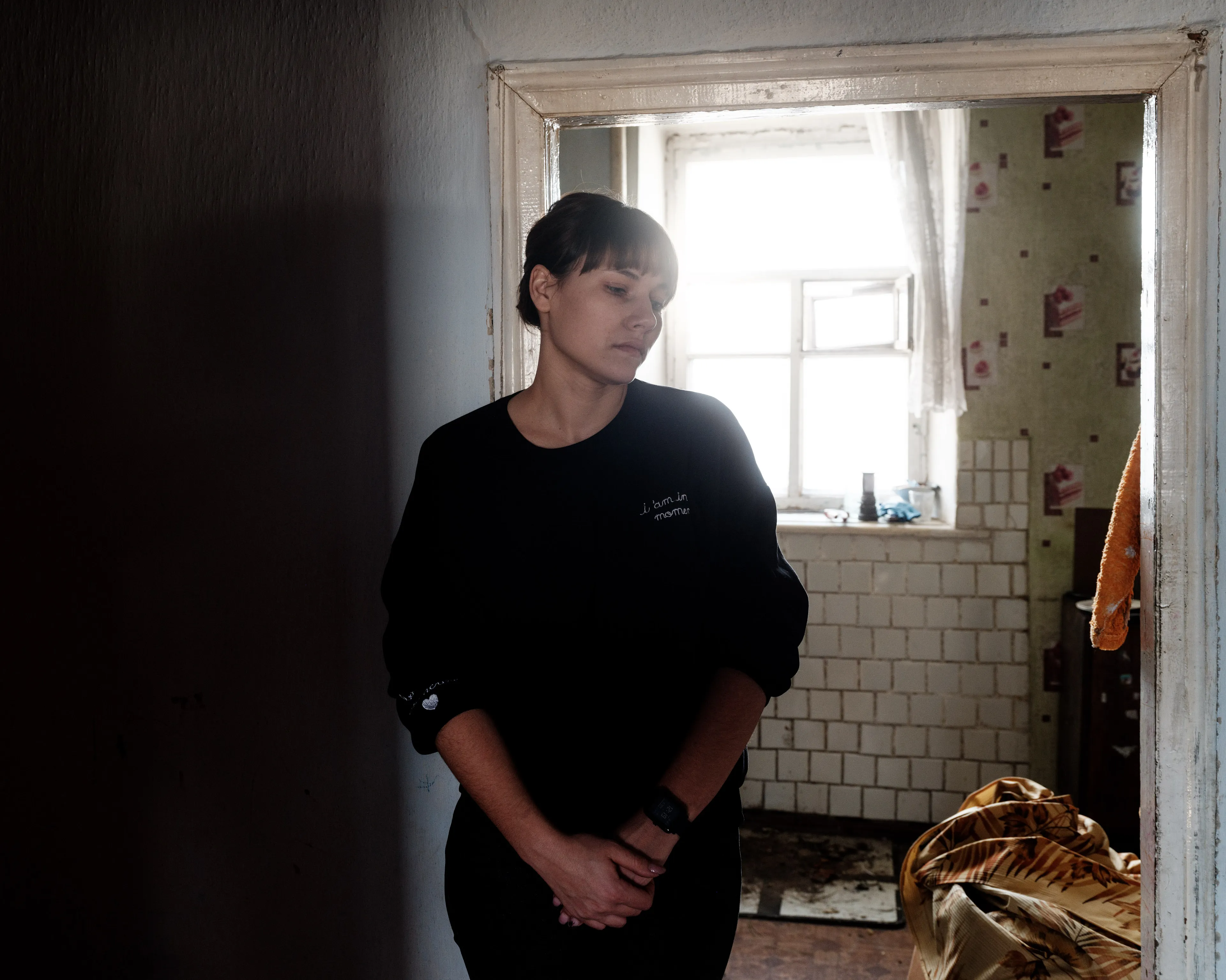 This selection of 100 images represents my trip to Ukraine from the 14th of February 2022 until the 24th of February 2022, the day the Russian army started its invasion. - Victoria, 26 years old, mother of two children portrayed in her house, which was hit by a artillery fire.