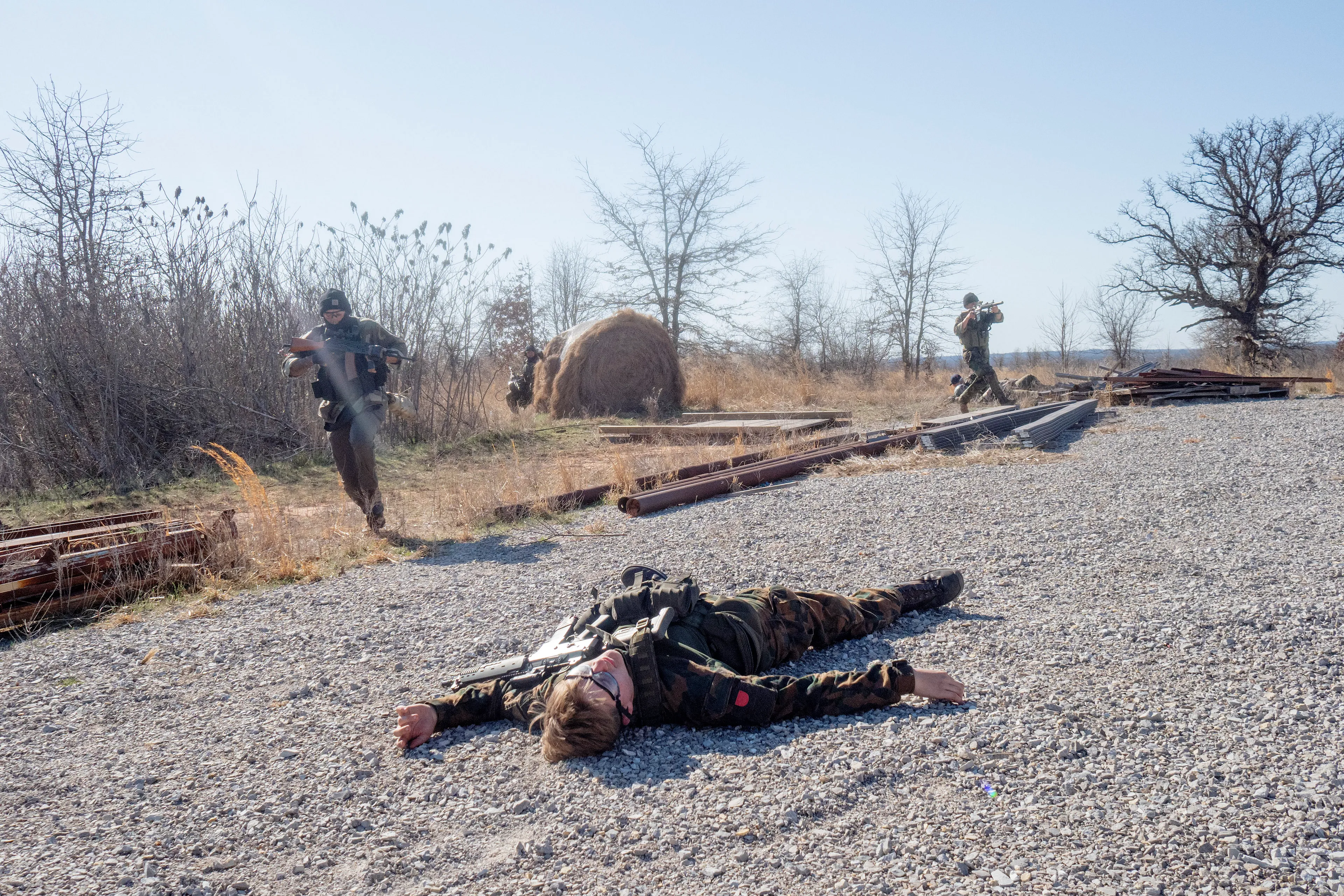 USA. Oklahoma. Overbrook. Battle Springs Ranch. March 2022. Final battle. Russian troops take a building from NATO forces and "win". Milsim, military simulation, airsoft weekend full immersion event. In a scenario where US and NATO troops, after loosing the battle of Kharkiv are trying to take back the Russian garrison town of Sarsk in the Rostov region close to the Ukrainian border. US FOR versus RUS FOR. Milsim West has been reenacting similar scenarios for a dozen of years and the similarity to current events is coincidental.