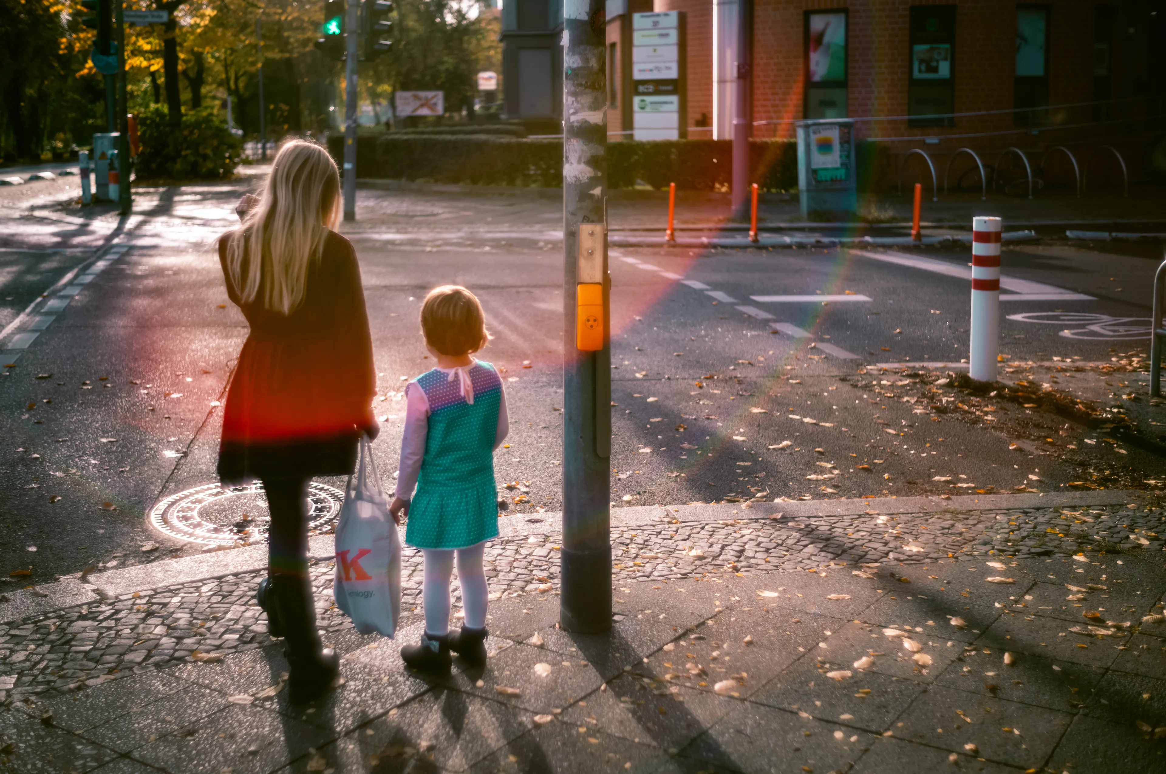 Heartbroken at 15, Clara still accompanies little Anja through Franz-Klühs Strassa to school in the morning, before the buses hum and bikes fly by. She holds back tears that burst into rainbows. The power of youth is so wide; their desire so strong and pure. And while Clara disregards this and that boy, she stops and fastens Anja’s shoes, so we can walk and not wobble over the asphalt road. She receives a text and a smile appears on her face. Everything feels so new, so fresh and yet so heavy.  